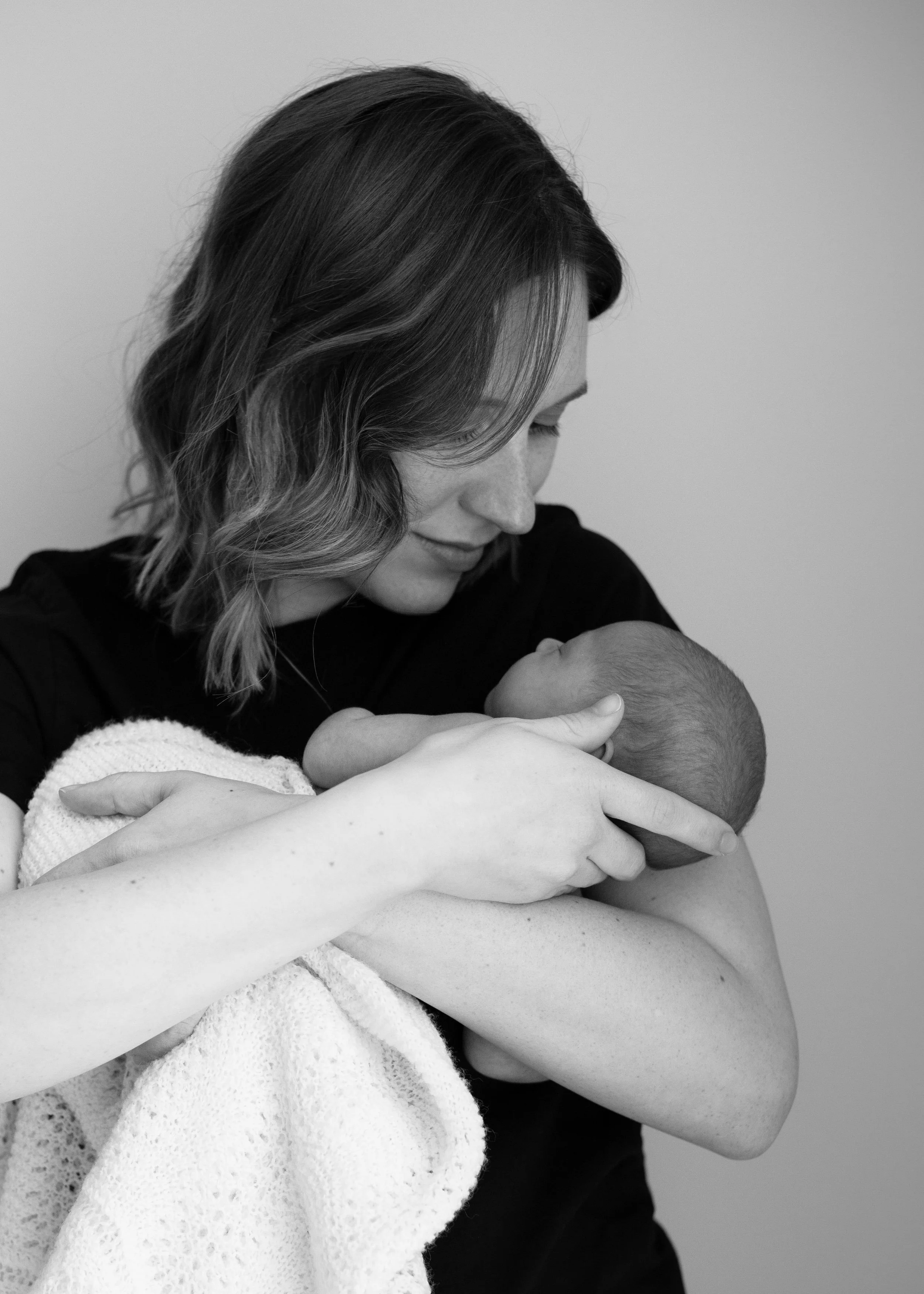 Mom and newborn portrait natural captured in-home for this Vancouver session