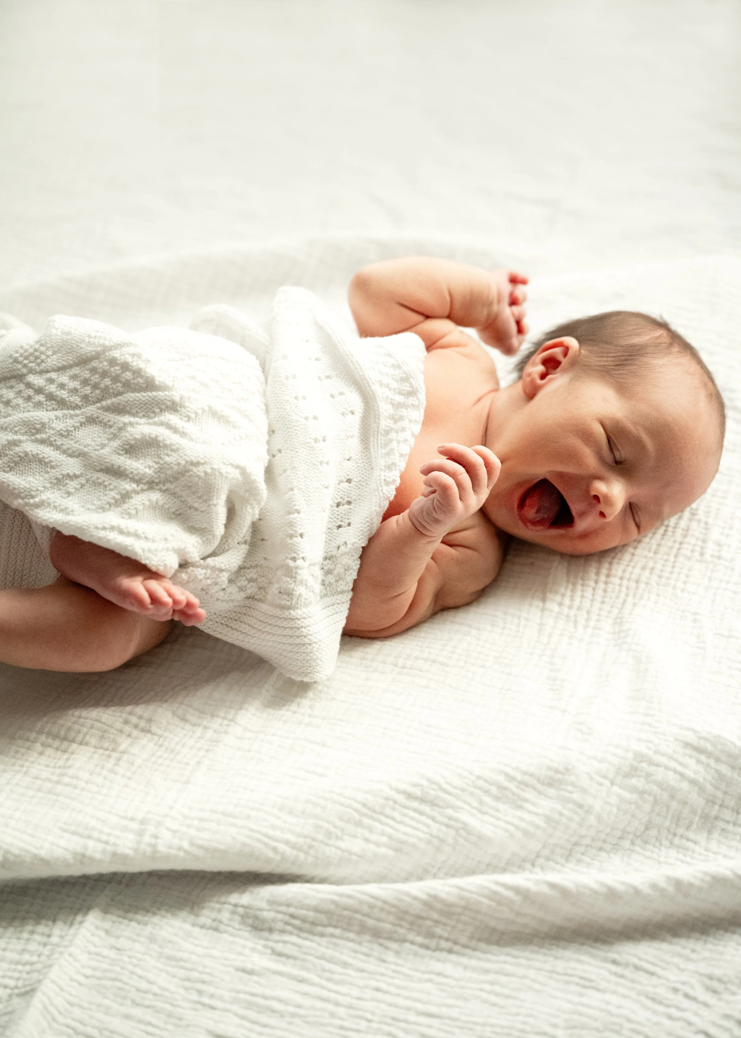 Expressive newborn baby captured by Vancouver Newborn Photographers