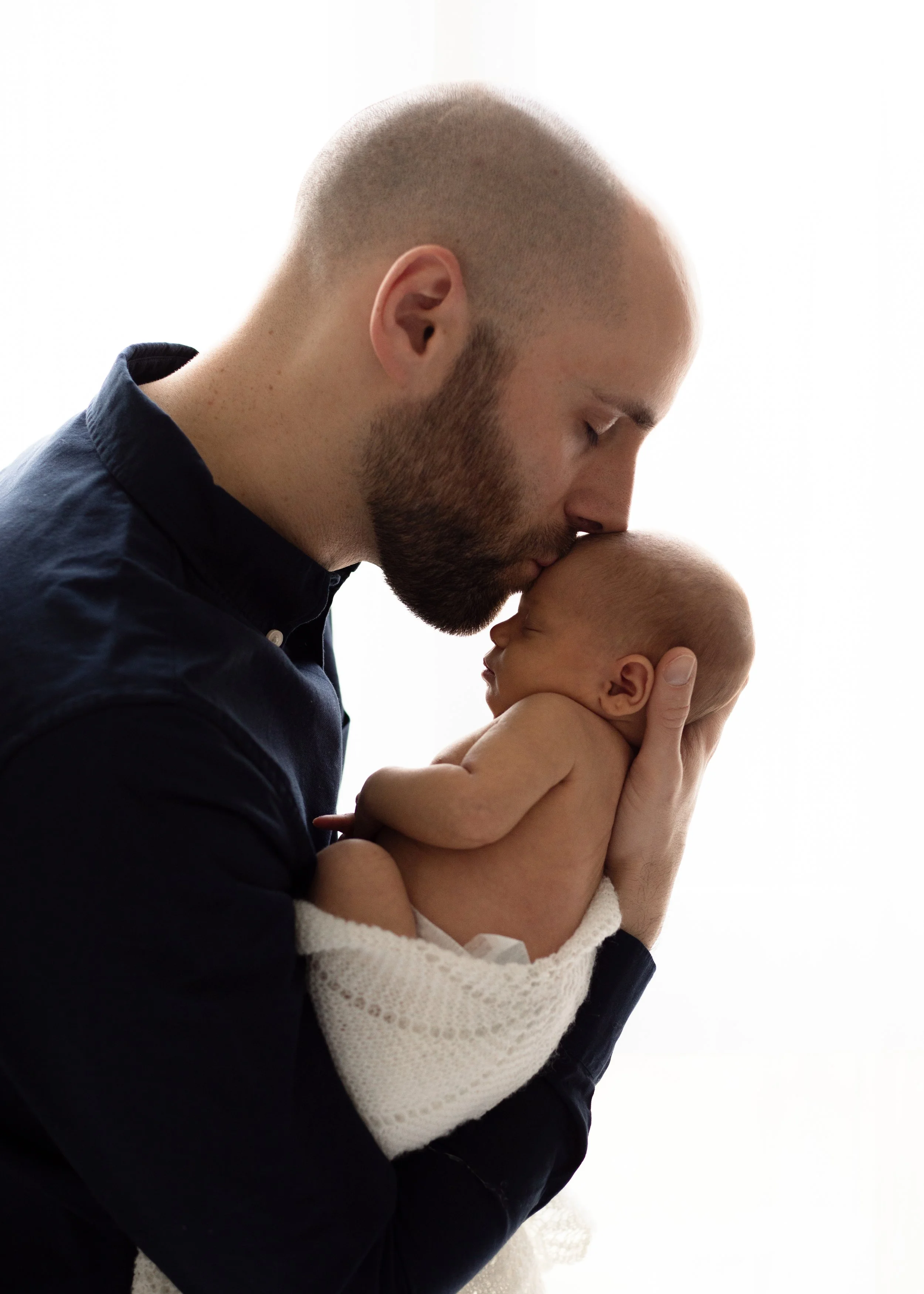 Newborn and Dad portrait captured by Newborn Photographers in Vancouver