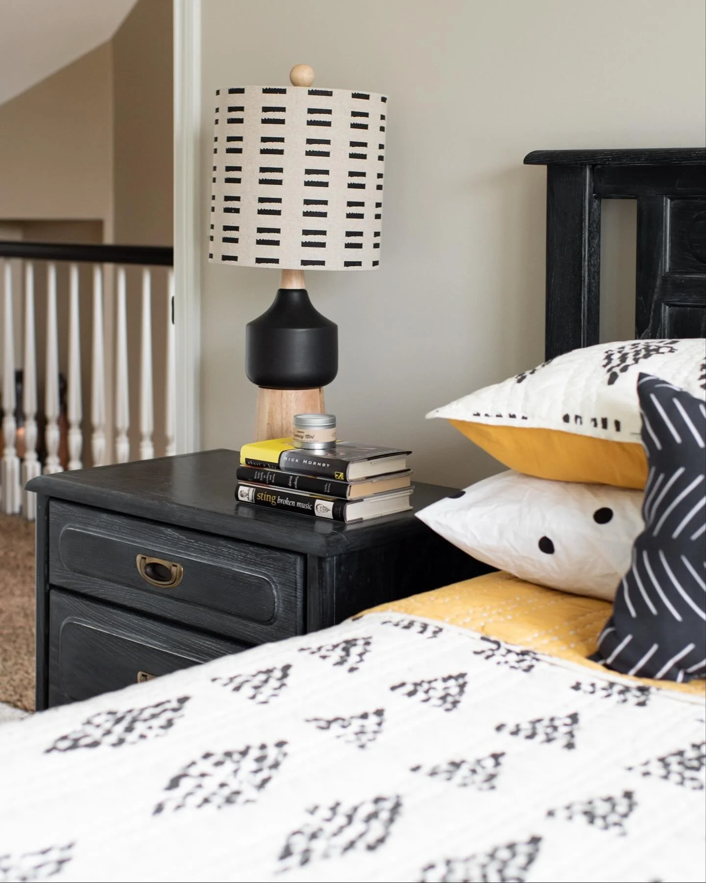 Yellow is one of my favorite colors, and while we don&rsquo;t use it often, when paired with black and white it always makes a bold statement. For this guest room refresh, we gave our client&rsquo;s existing bedroom set new life with a deep black fin