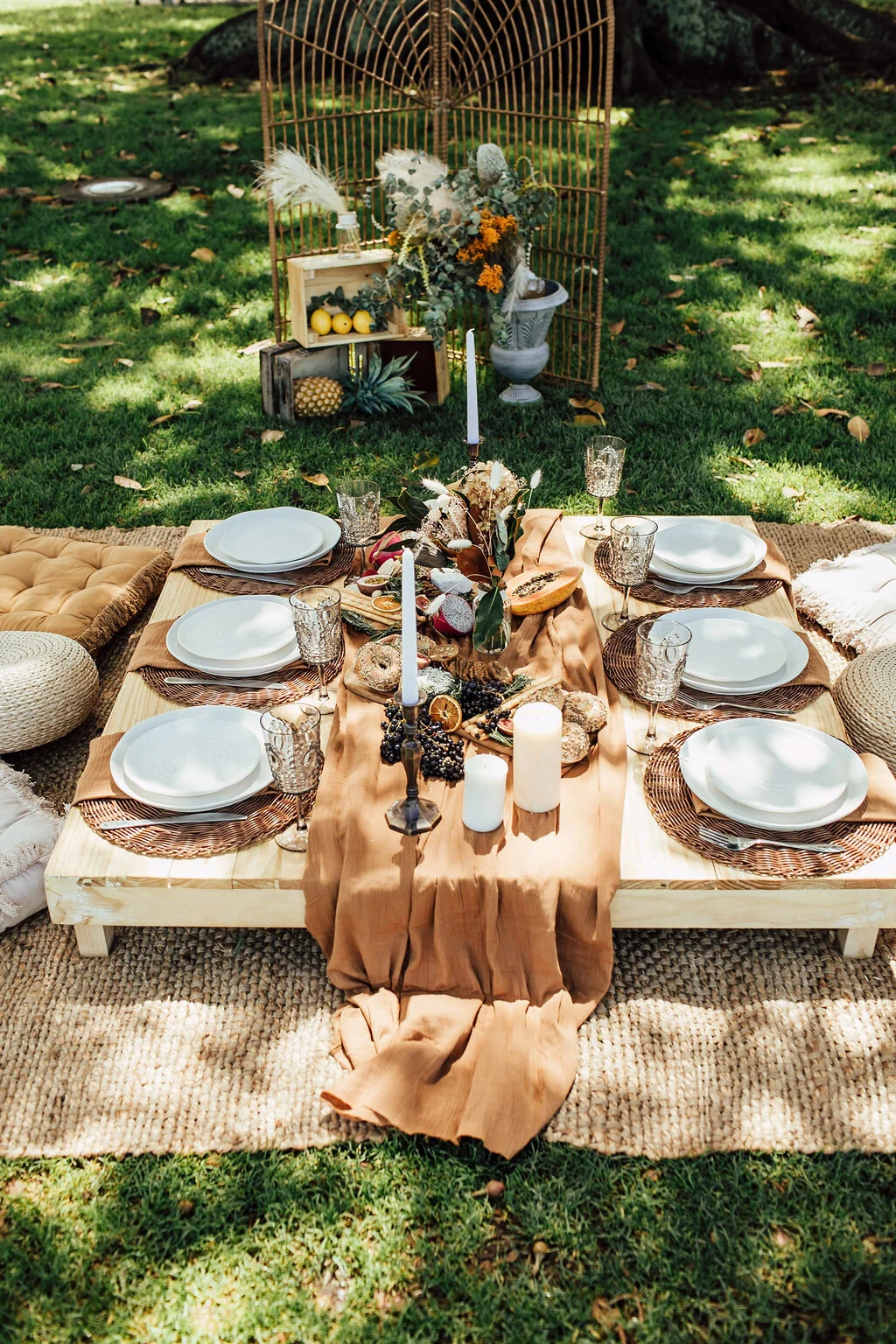 Elegant low-table picnic setting by Milk & Honey Picnics