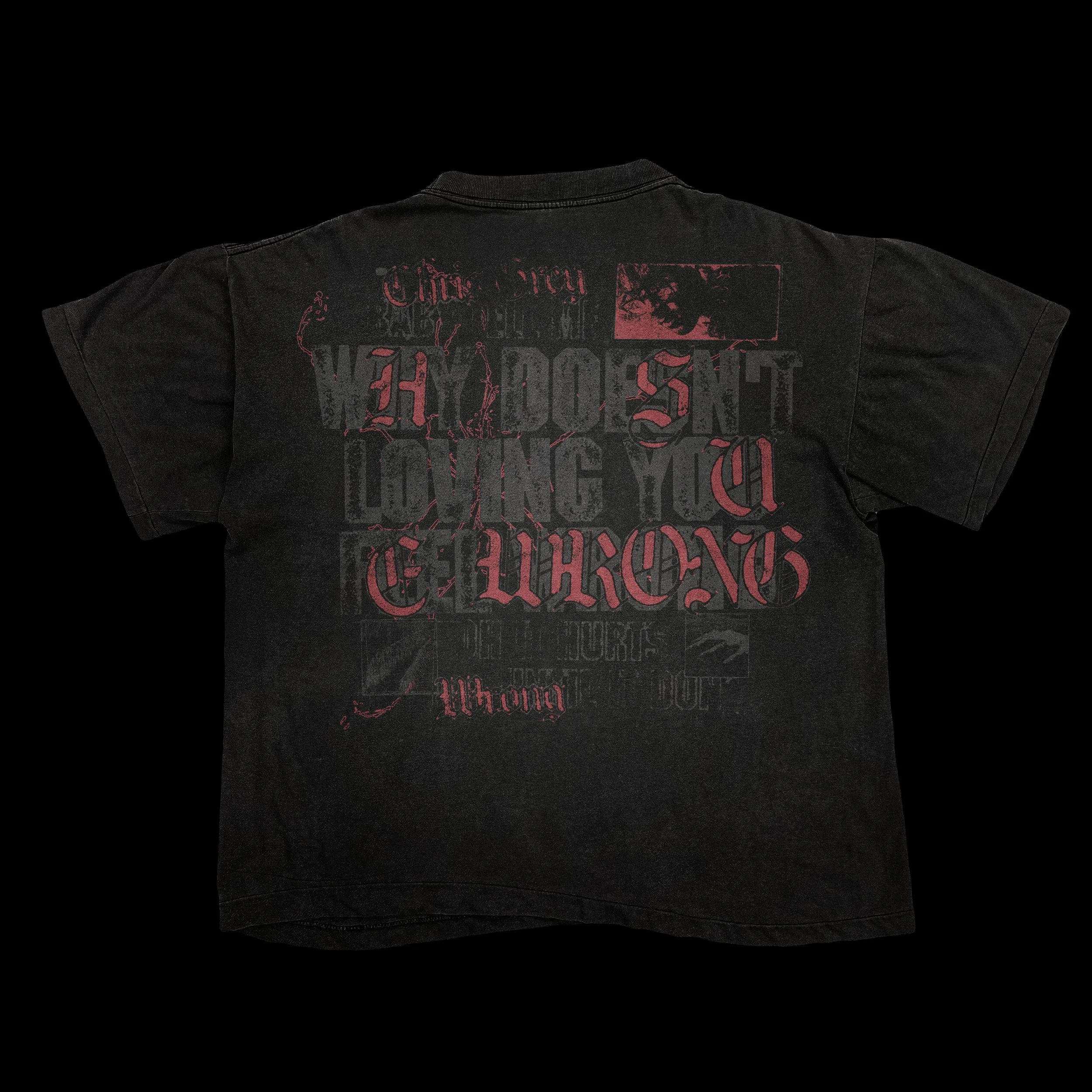 Black T-shirt with red and black text and graphics, including various phrases and images, displayed against a black background.