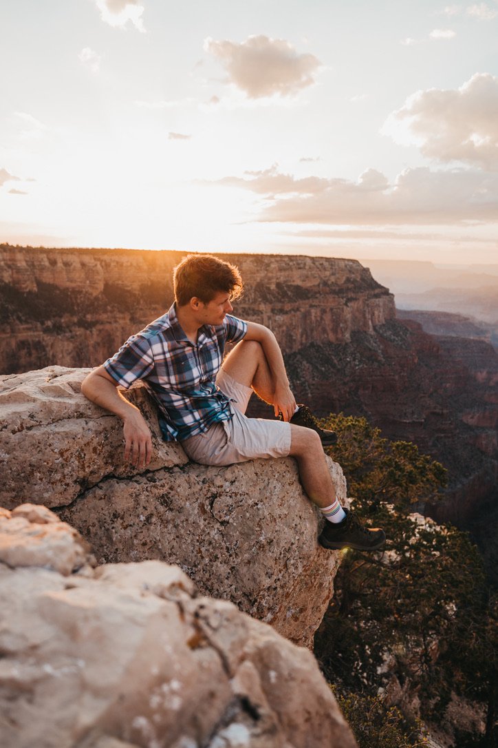 Conner Eckdahl sits and looks into the Grand Canyon during a destination photoshoot in Arizona