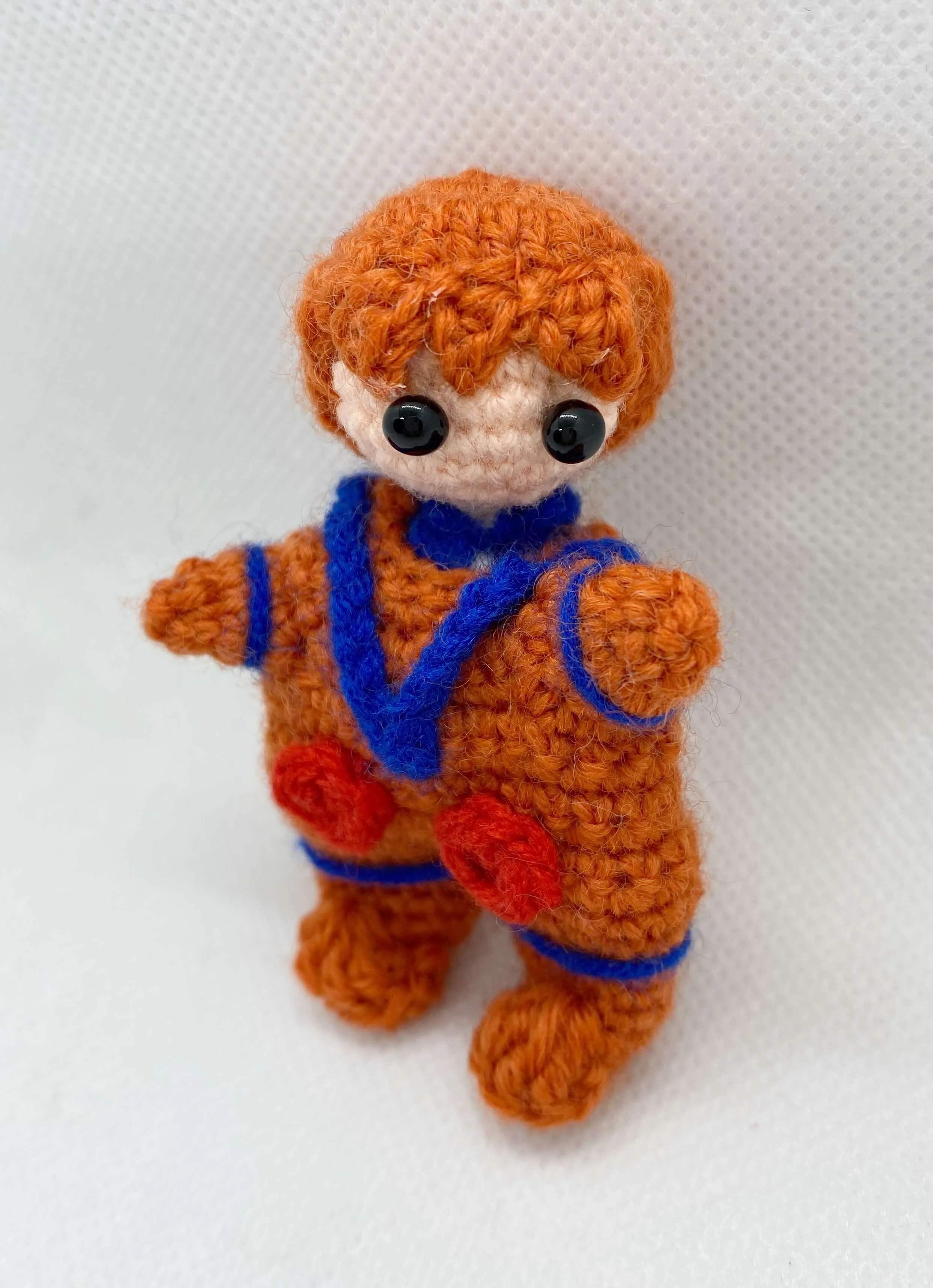 crochet orange astronaut suit.jpg