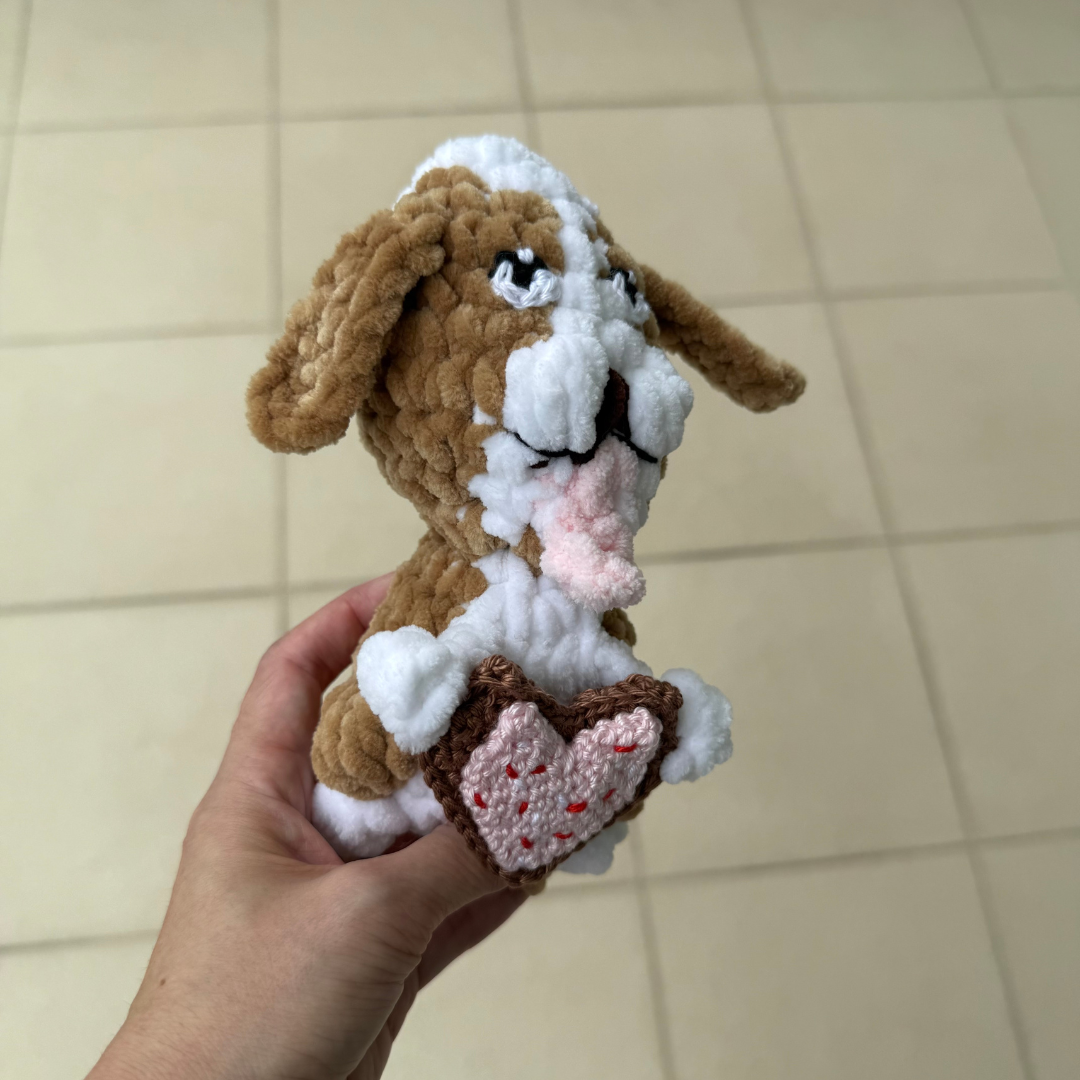 crochet dog with heart cookie.png