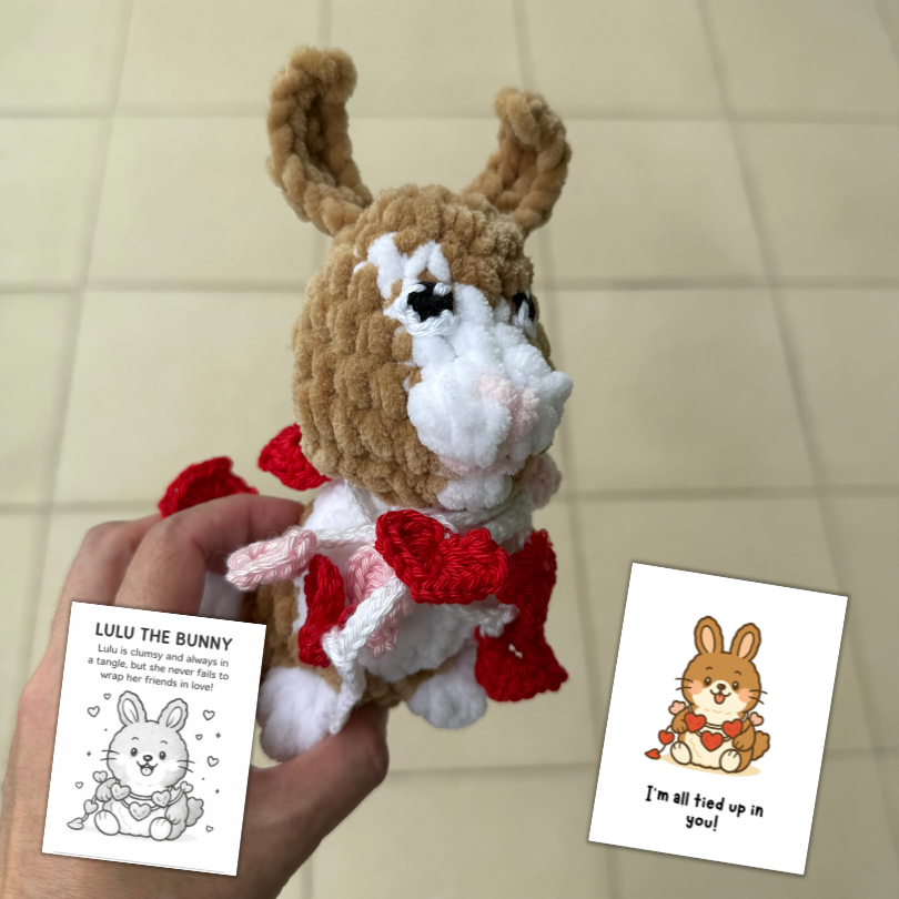 crochet bunny tangled in heart garland.png