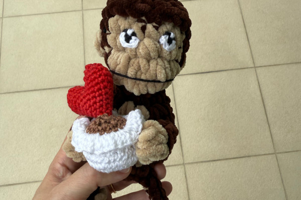 monkey holding potted heart plant