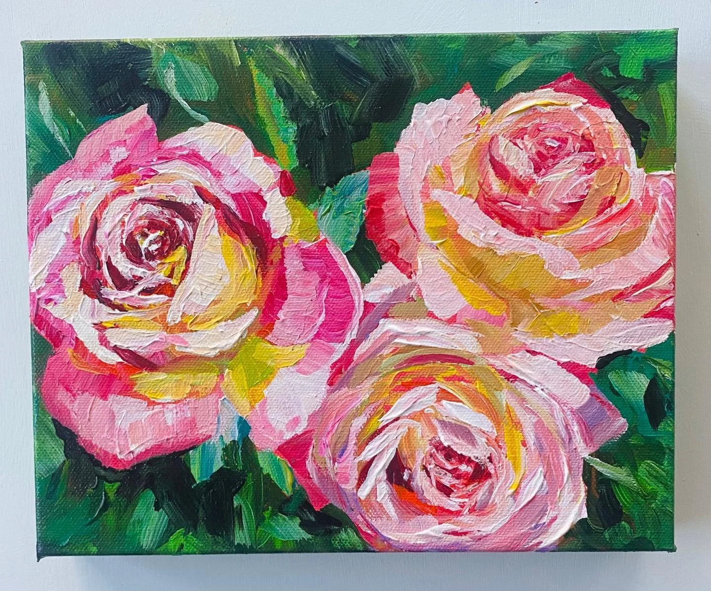 Light gathers at the heart of the bloom,
a soft, golden warmth that seems to breathe.
The outer petals hold it gently,
as if protecting a quiet ember
meant to comfort anyone who looks closely.

&ldquo;Love and Peace&rdquo; roses 8x10x1.5 inch acrylic