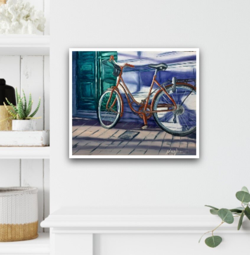 Red bike painting hanging on a wall