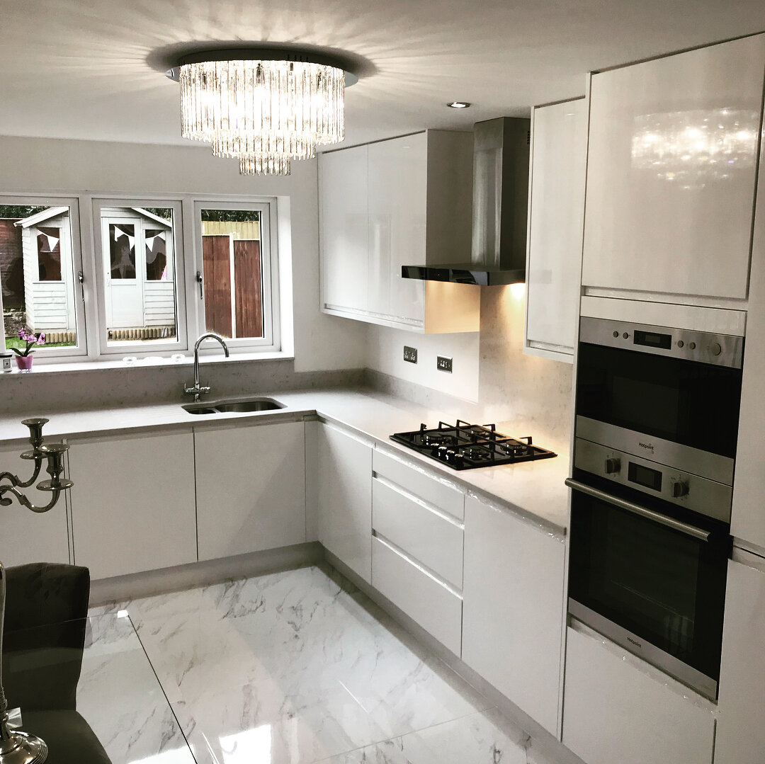 White Gloss acrylic doors with Ocean White Quartz tops 👌🏻 #kitchendesign