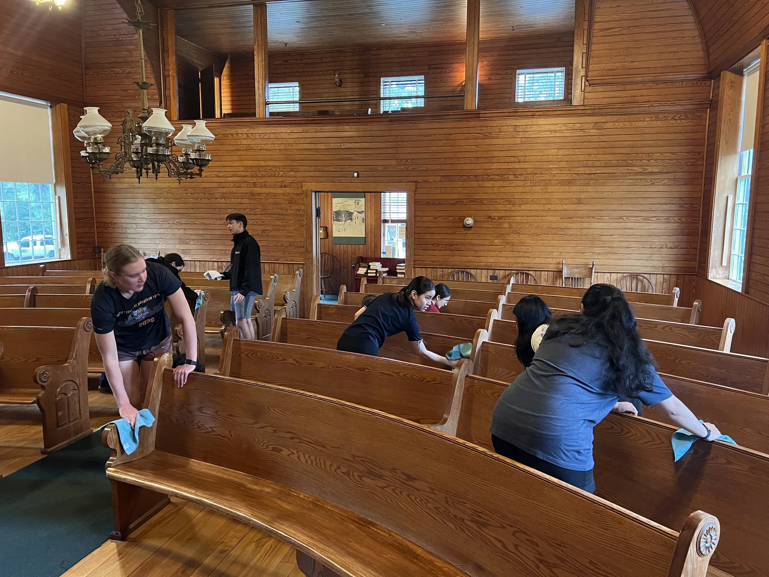 As part of their service project in Plymouth Notch, the Scholars refinished the pews in the Union Christian Church