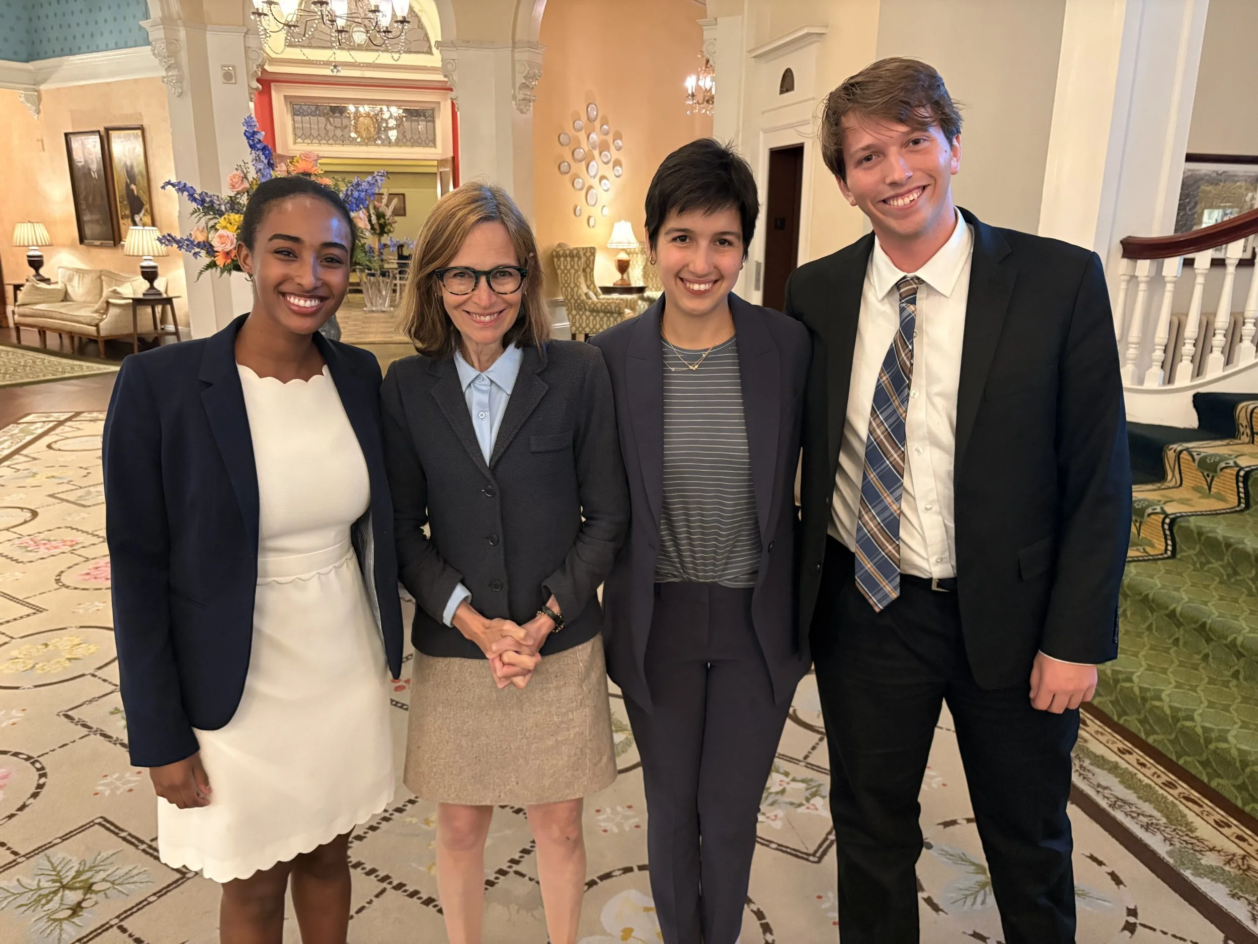 At the Mount Washington Hotel, site of the 1944 Bretton Woods Conference: Coolidge Foundation chair Amity Shlaes (second from left) with 2021 Coolidge Scholars Adie Selassie , Emma Finn , and Matthew Gilbert