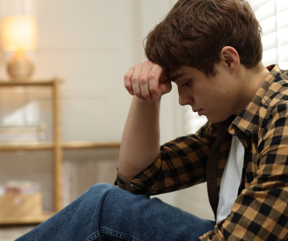 Teen boy looking sad