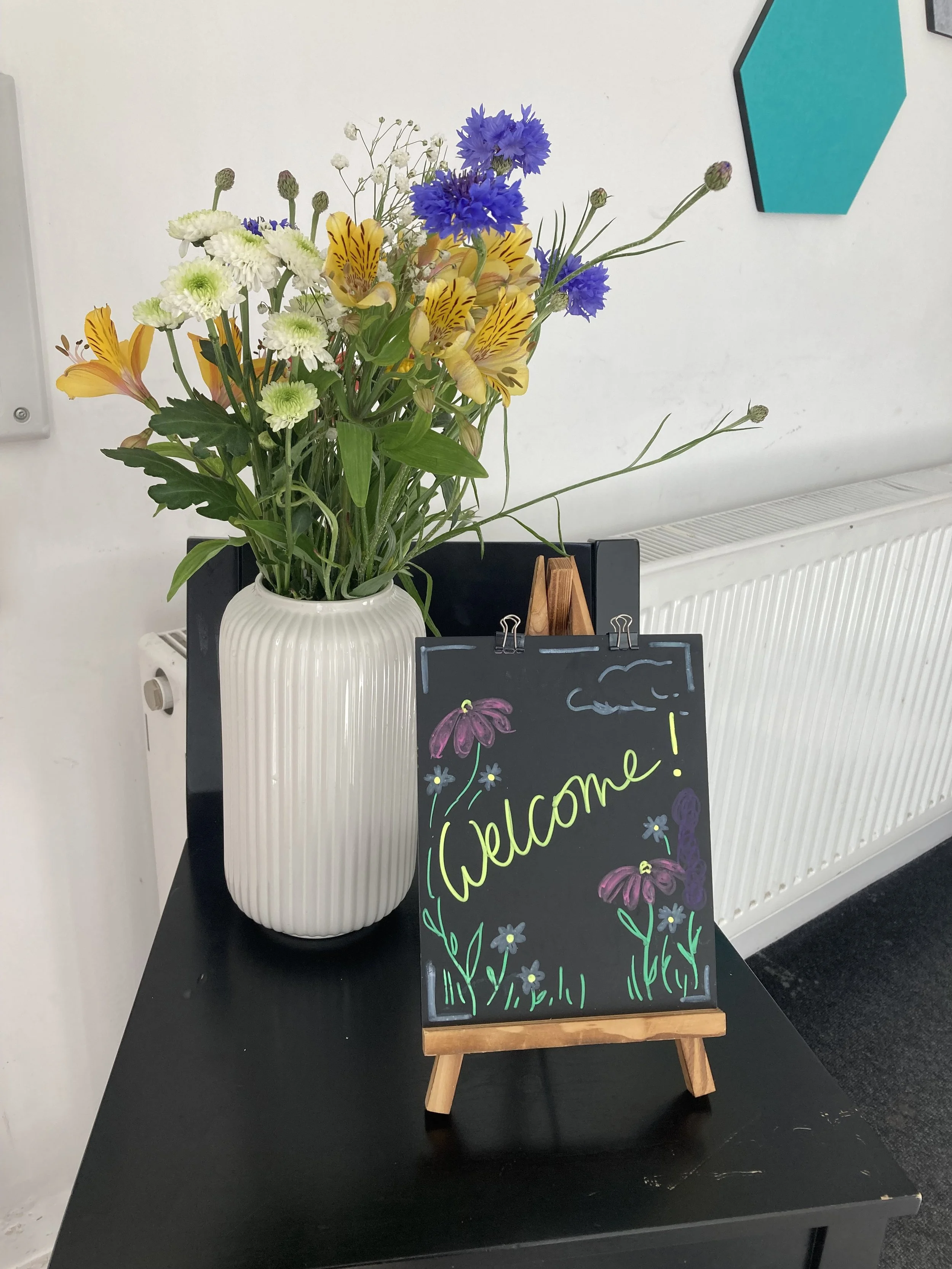 Welcome with flowers.jpg