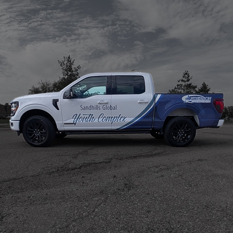 Pickup truck with cool partial wrap for sports complex
