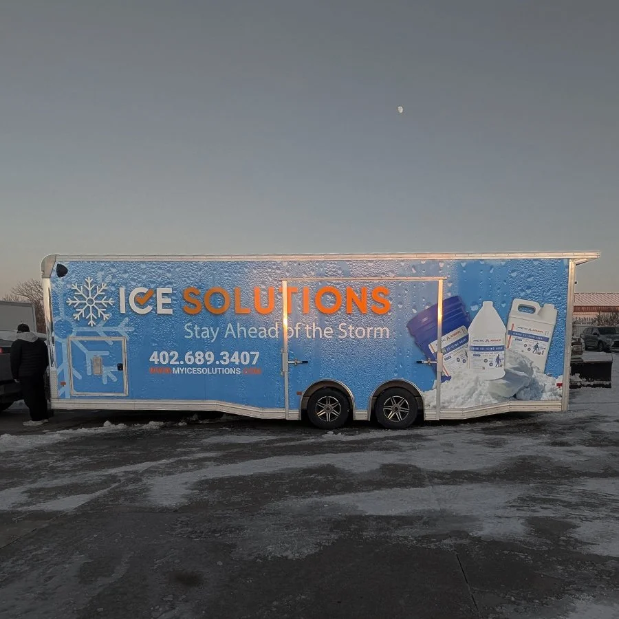 Large 28 foot enclosed trailer with a vibrant commercial wrap design printed and installed locally
