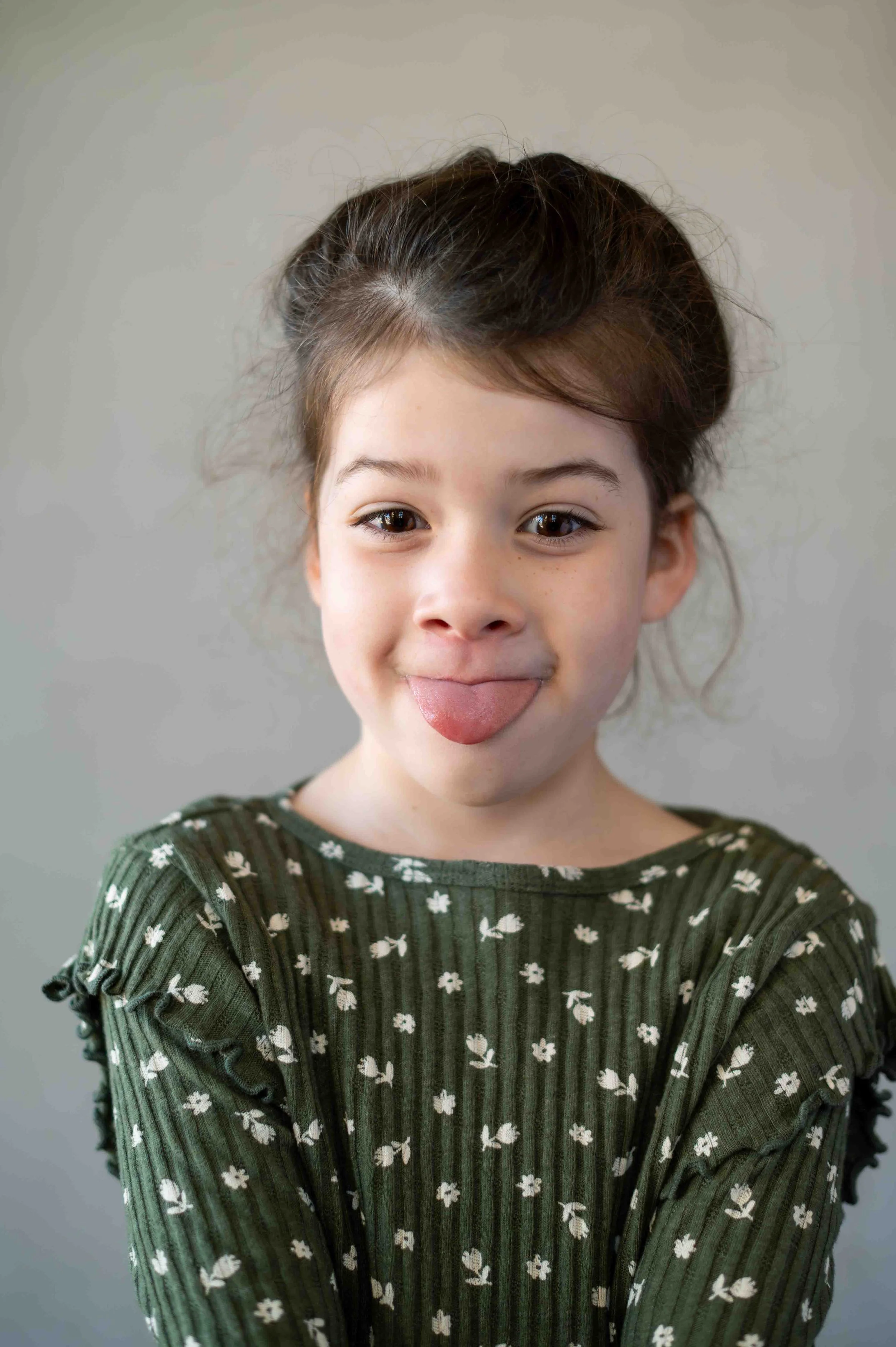 Student makes a silly face during their school photo day with the Longmont school photographer