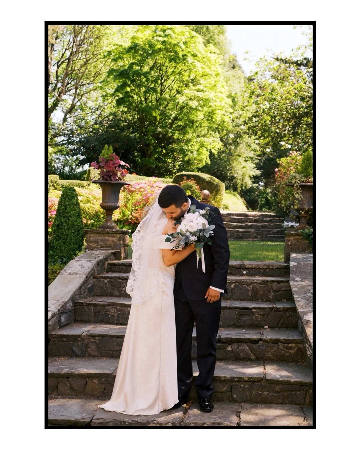 Florin, Wales.

An intimate garden ceremony set within the grounds of a beautiful old Welsh castle-like manor, with warm sunshine and the quiet sound of a violin drifting through the gardens. Surrounded by a small group of their closest family and fr