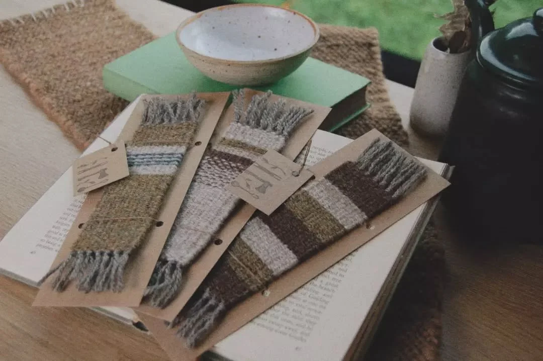 A cosy reading session needs a cosy bookmark.
Hand woven with 100% wool, there's a few new ones on my shop now 📖