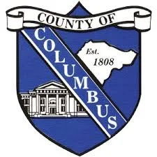 County of Columbus seal with a shield featuring a building and the state of Ohio.