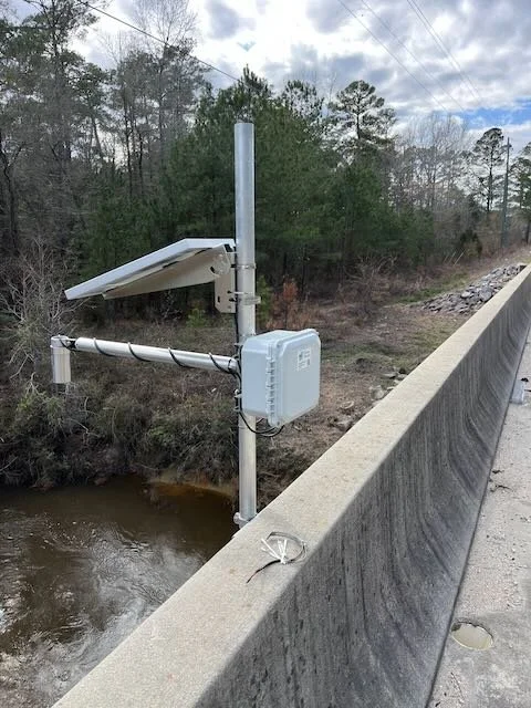 A water level sensor monitors a frequently flooded creek.