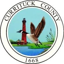 Seal of Crittuck County featuring a lighthouse, a flying bird, and a river scene with grasses, encircled by the county name and the year 1668.
