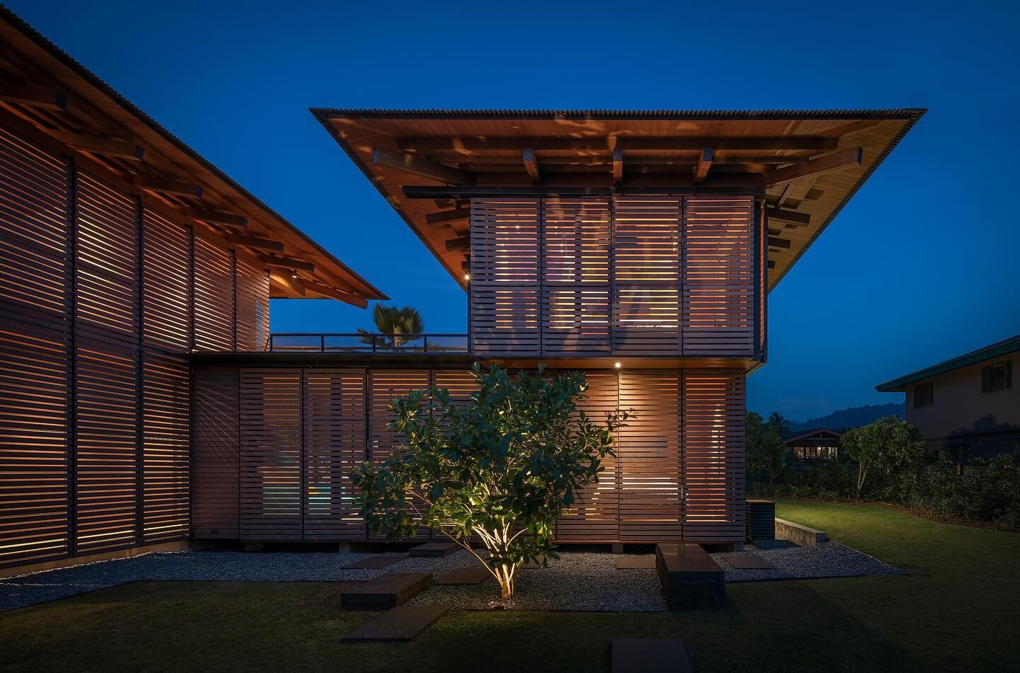 More stunning photography of our Hale Napo&rsquo;o Kauai project - @olsonkundig utilized operational wood shutters made from cedar to provide storm protection and security. We sourced brightly colored woven furniture from @paola_lenti_official for ma