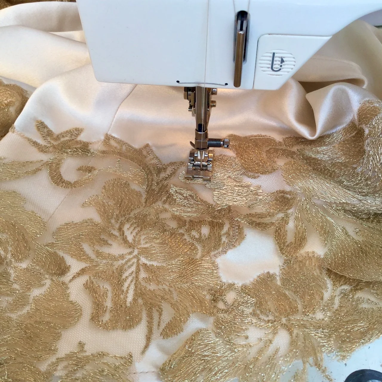 Machine sewn lace appliqué