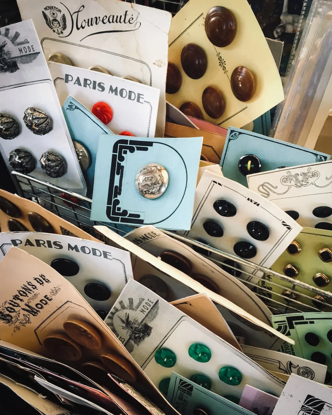 A box of assorted vintage sewing buttons