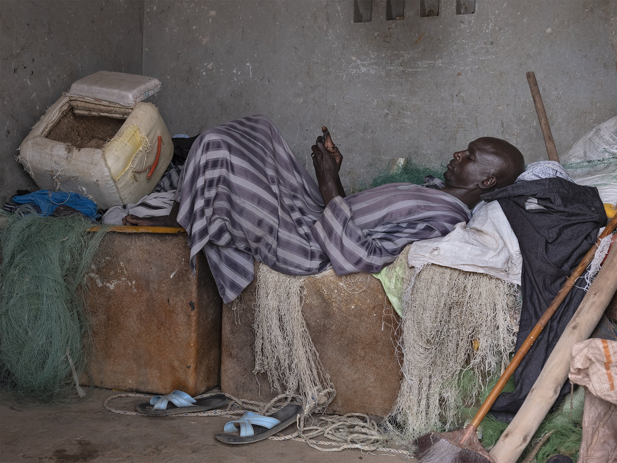 THE POVERTY TRAP -
With their income declining at an alarming rate, Lebou fishermen like Chiekhou Oumar Dieye can no longer save money and must go into debt. A cessation of activity due to illness often throws them into poverty