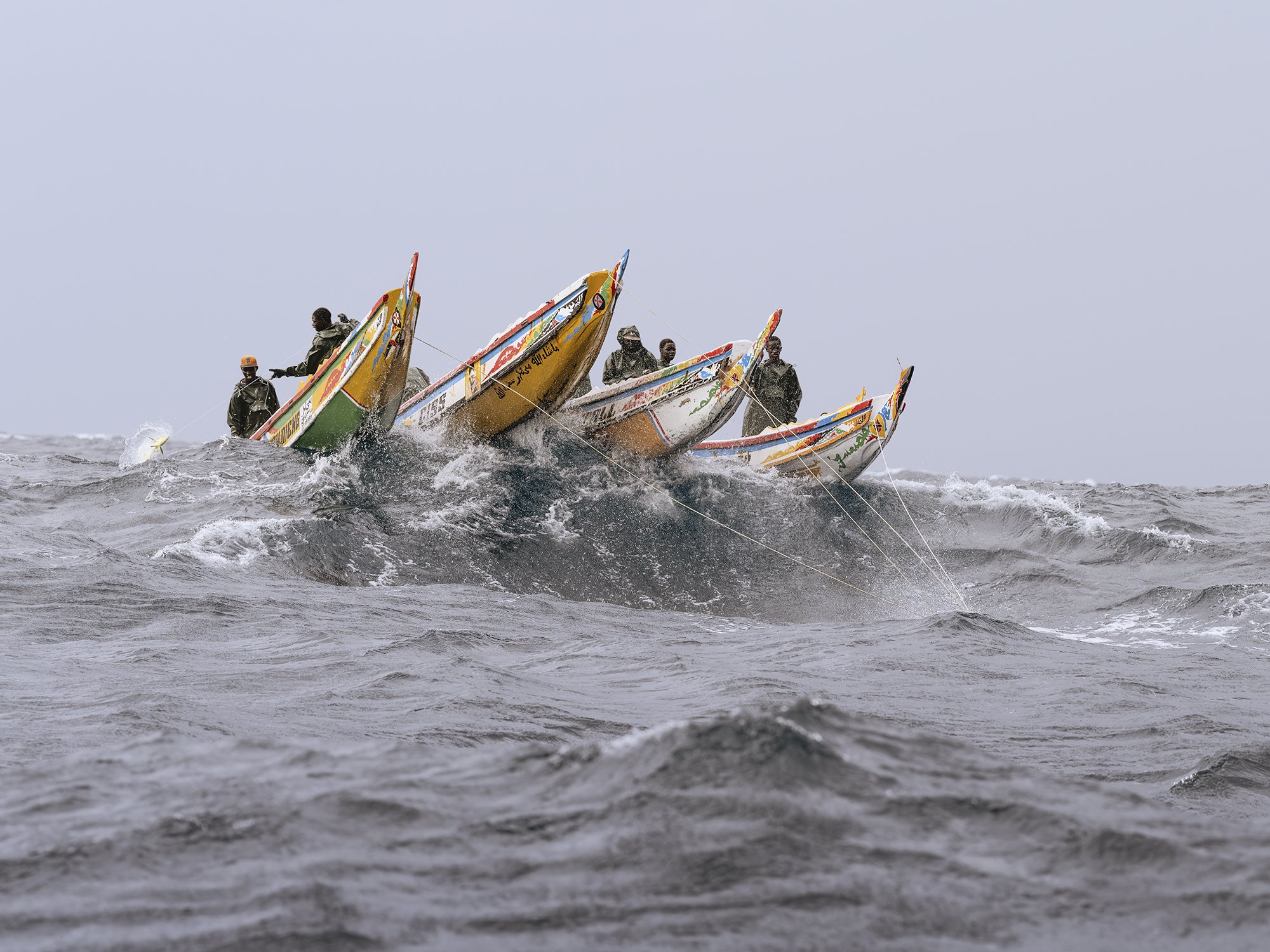 GOING TO THE EXTREMES -
In search of fish to catch, Lebou fishermen sail ever further offshore with their frail wooden canoes, often facing rough and dangerous conditions. More often than not, they do not catch enough fish to cover their operating c