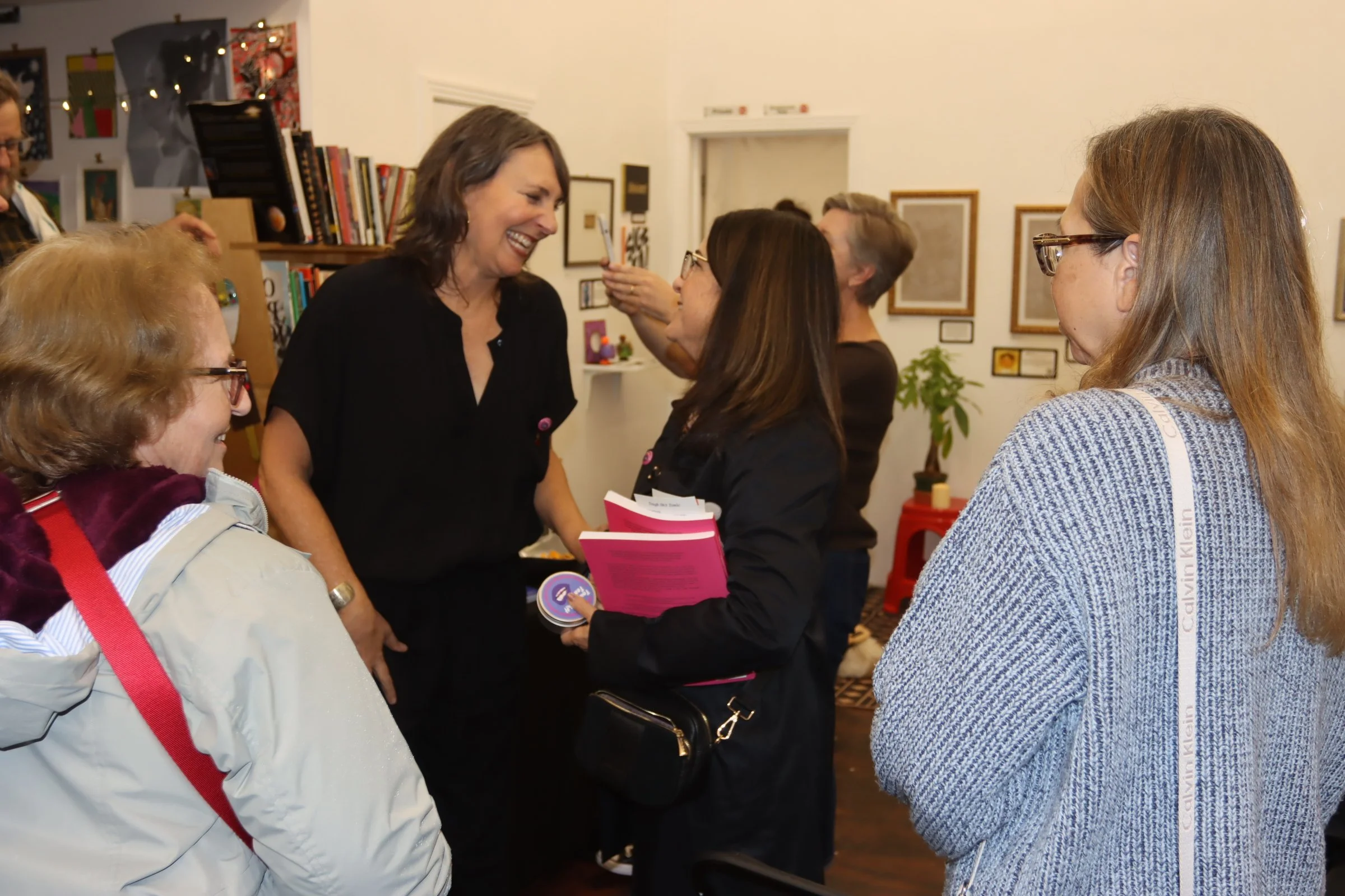 Arianne talking with attendee at Book Launch