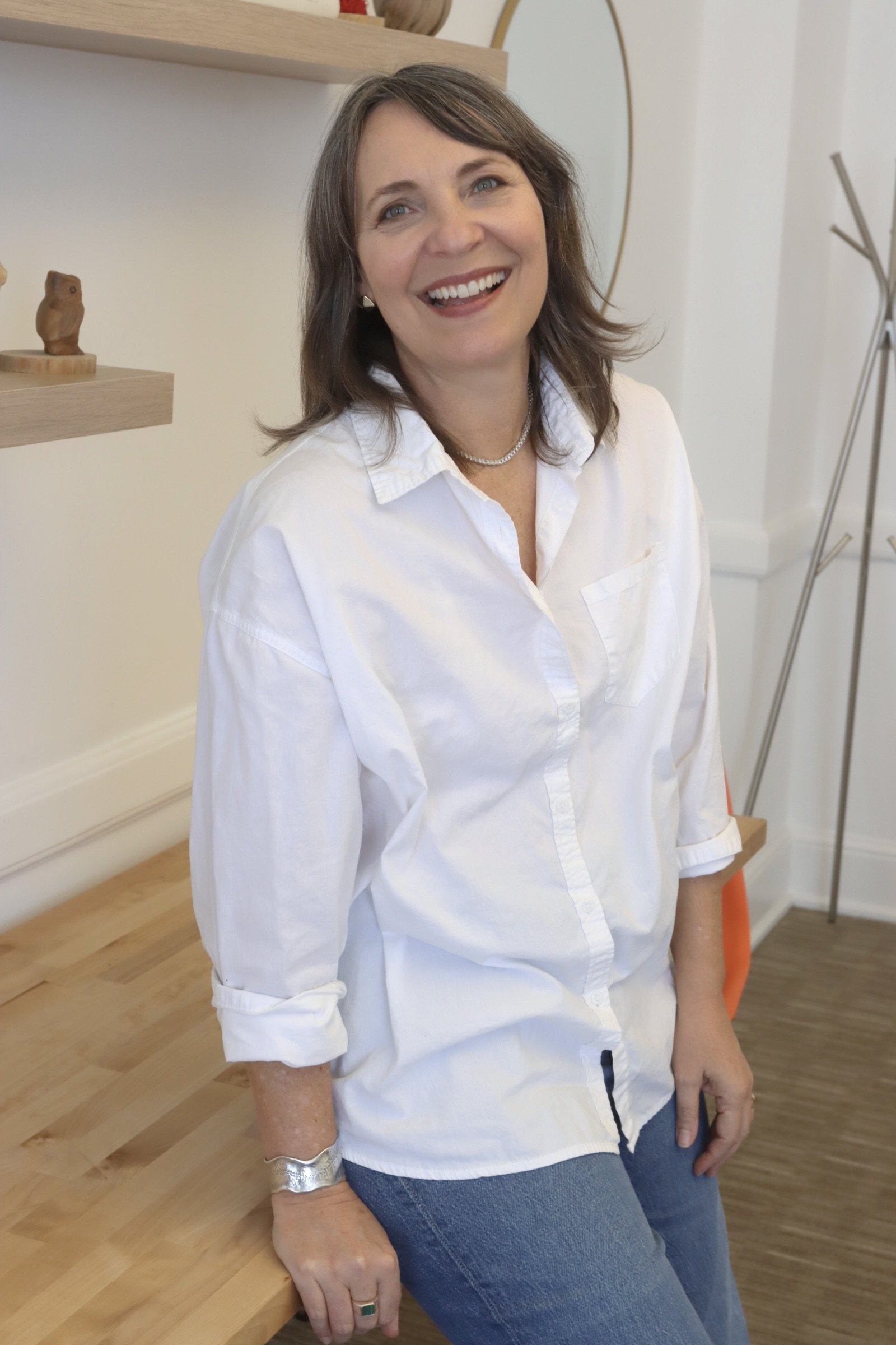 Arianne MacBean Standing Portrait  leaning against table