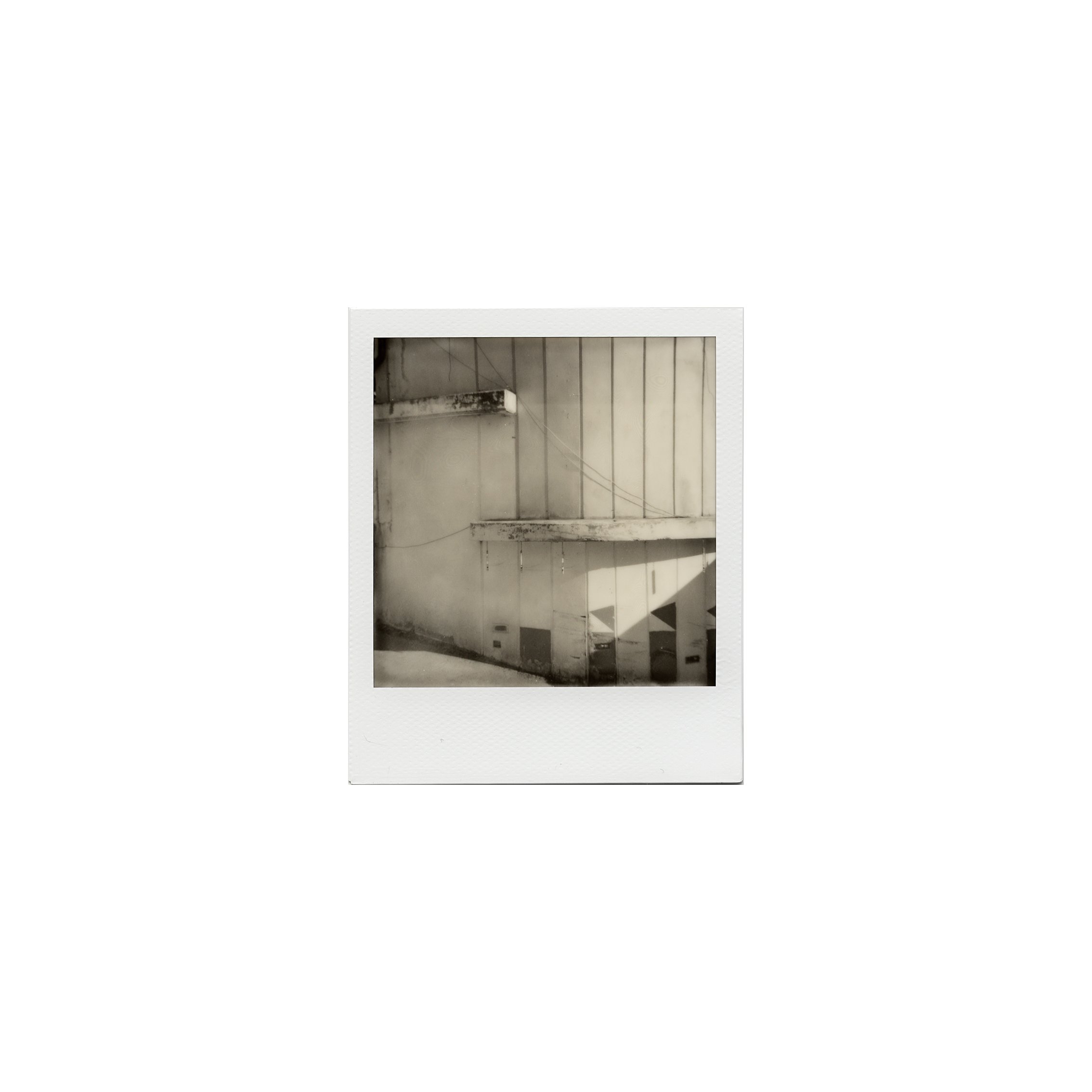 In the heart of the Balkans, reinforced concrete and construction materials tell stories of a bygone era. This photographic work explores the remnants of socialist architecture, where concrete buildings, once symbols of progress and unity, now offe