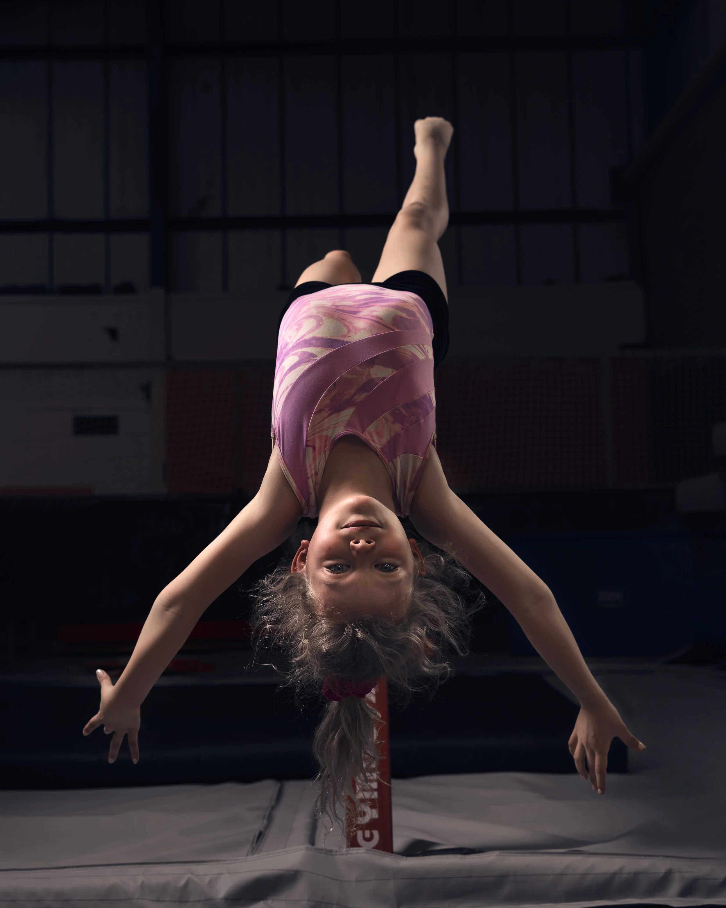 upside down laying on beam.jpg