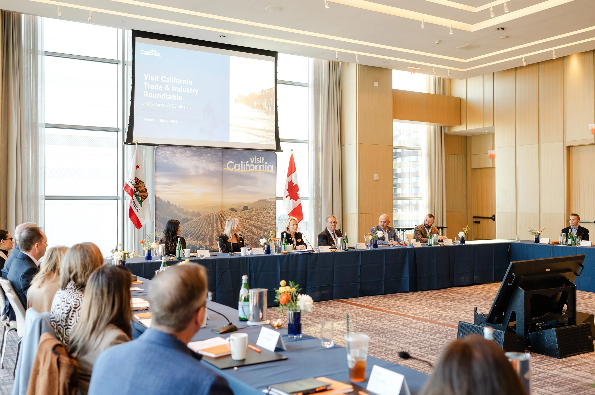 a UN style conference where travel industry delegates are discussing how to boster Canada to US travel . Corporate event photography, business event photographer, professional event photography