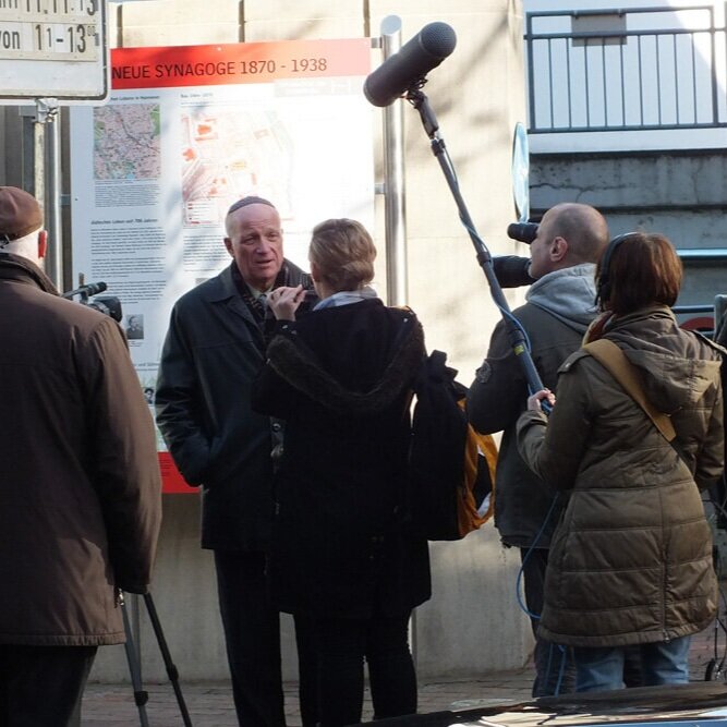 Beny speaking to media after laying of Stolpersteine