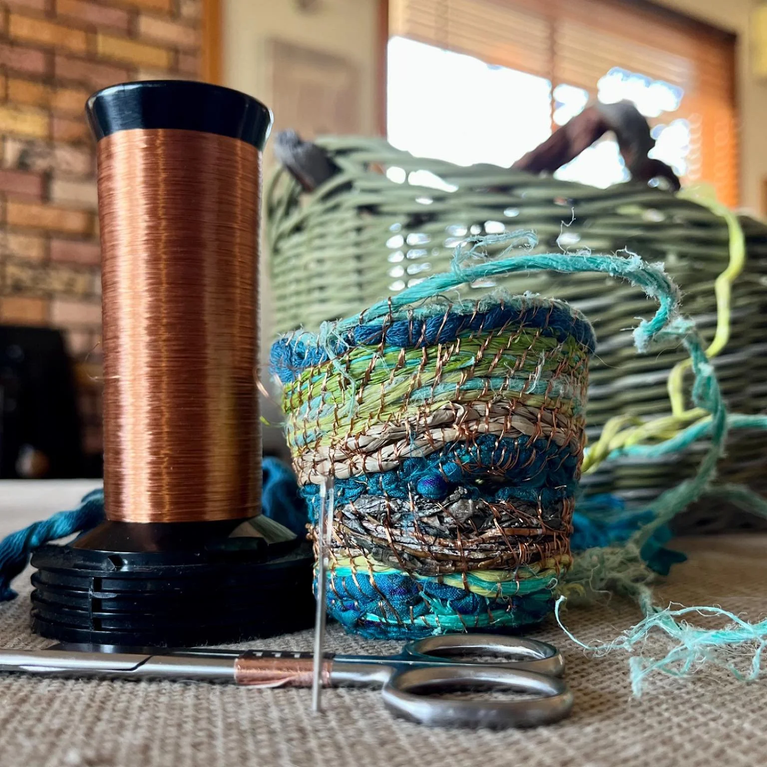 Wednesday weaving #WIP ~ a tiny coiled vessel using reclaimed copper wire, coastal flotsam and jetsam and recycled textiles. The combination of textures is wonderful!

#wipwednesday #weaverfever #wovenart #fibreartist #basketry #coiledbasket #handmad