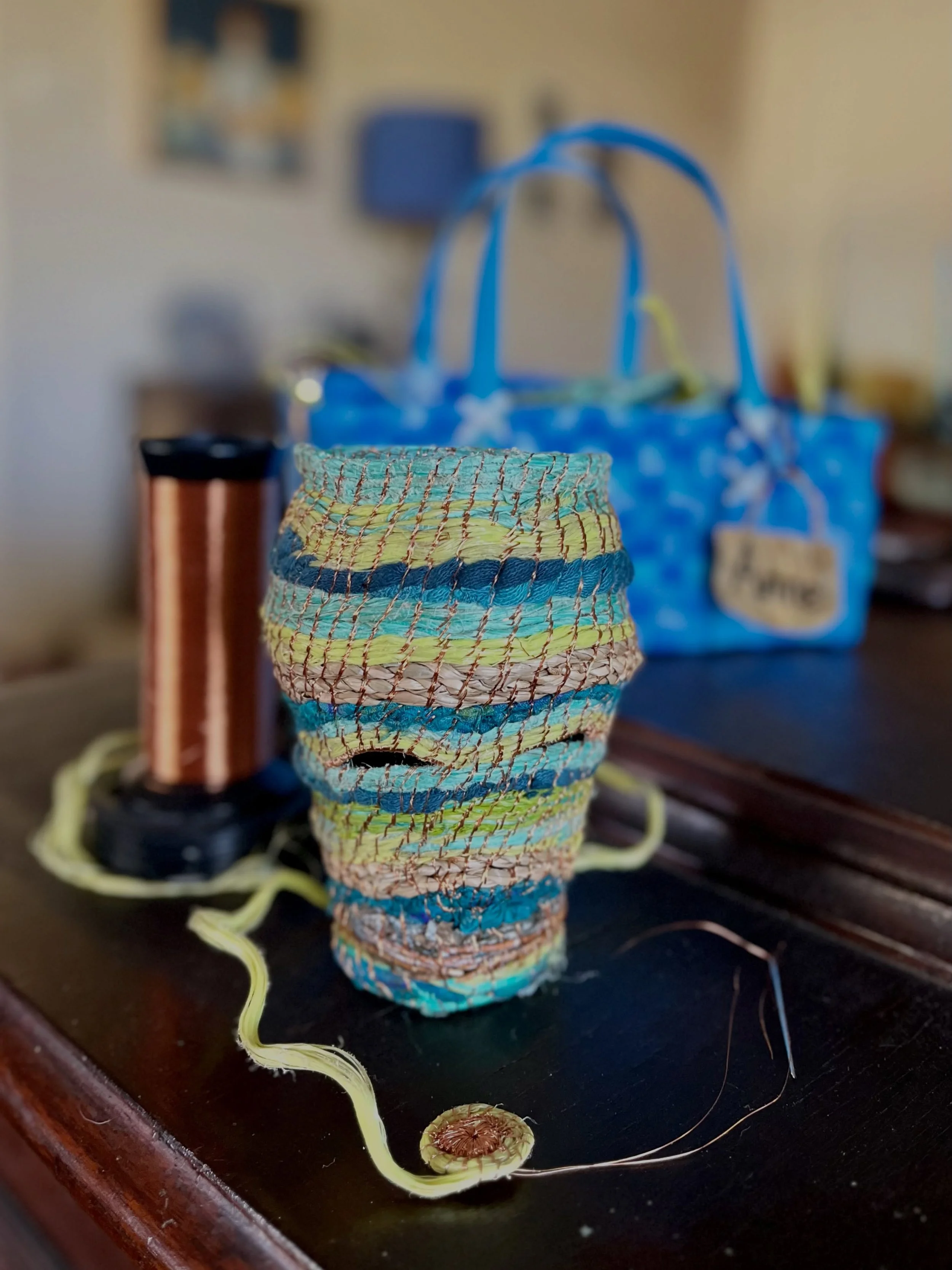 Friday finished object ~ my wonky woven vessel is done, although I have decided to make it a little lid ~ because I can! 

Materials ~ recycled and reclaimed ghost netting, copper wire, sari silk, and other flotsam and jetsam

Process ~ coiled basket