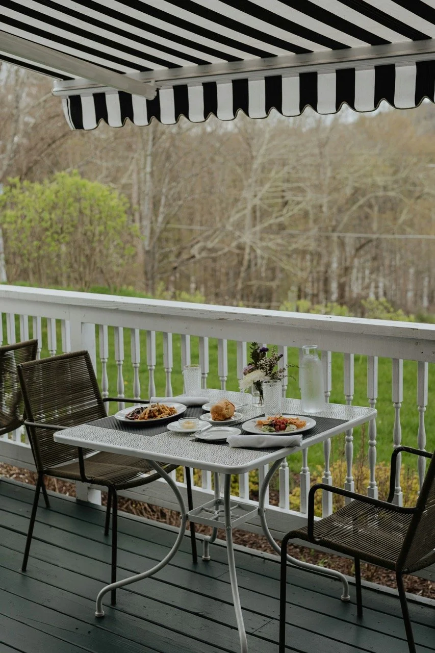 CBI Blinds Example Black and White Stripe Auto Awning.jpeg
