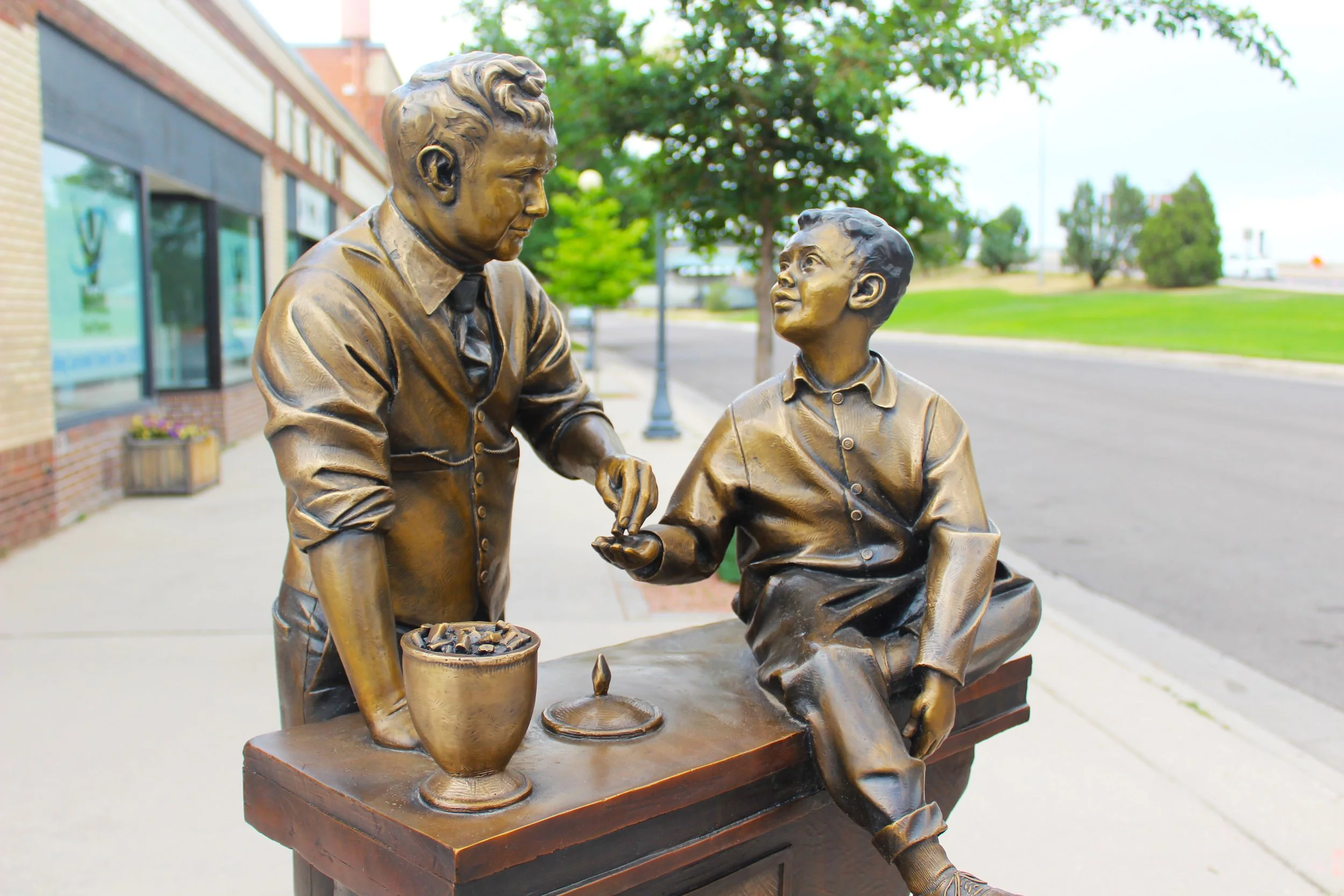 bronze statue sculpture father and son figurative Cheyenne Wyoming public art