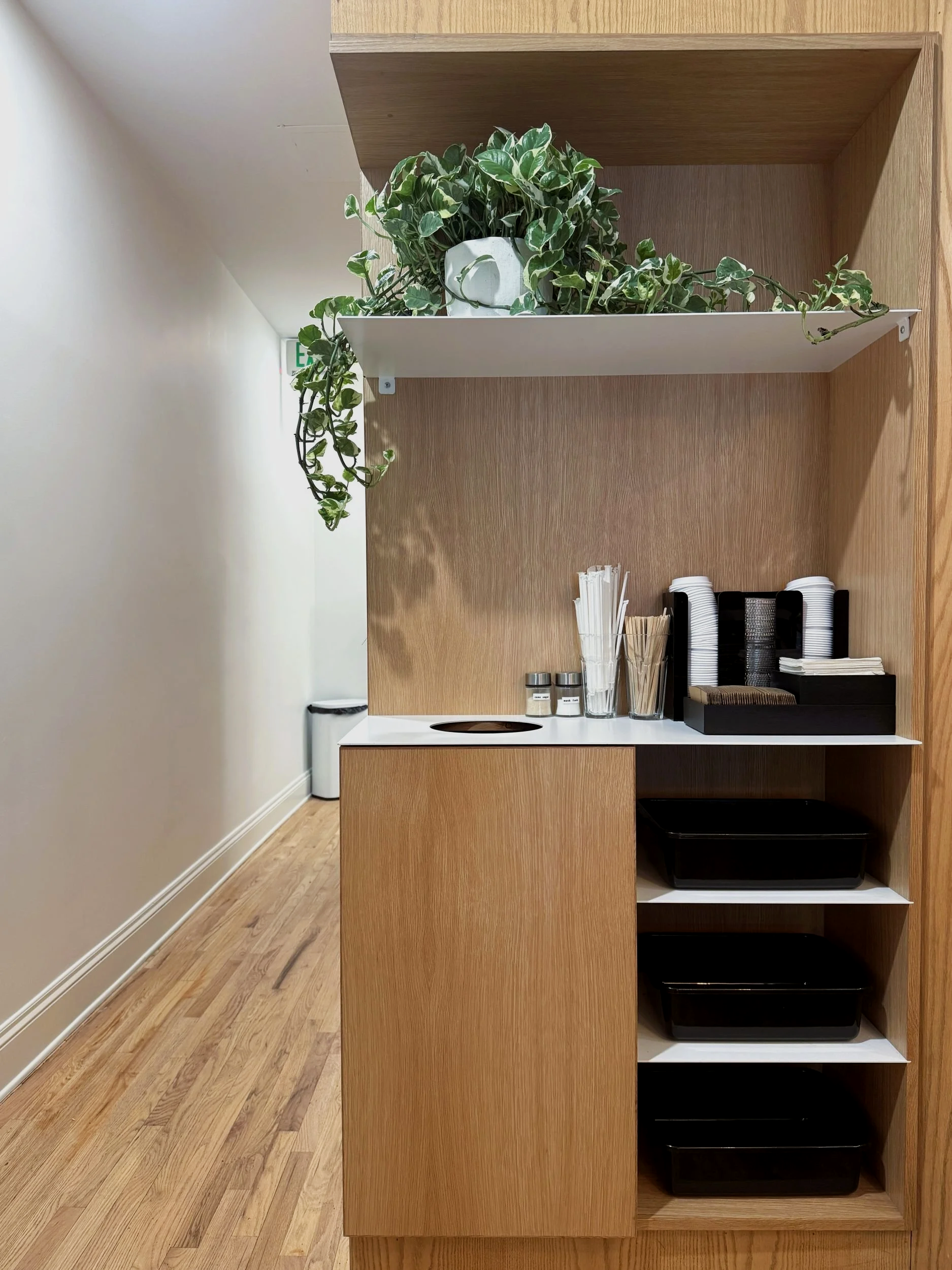 Hearth Highlands custom built-in trash and bus bin cabinet