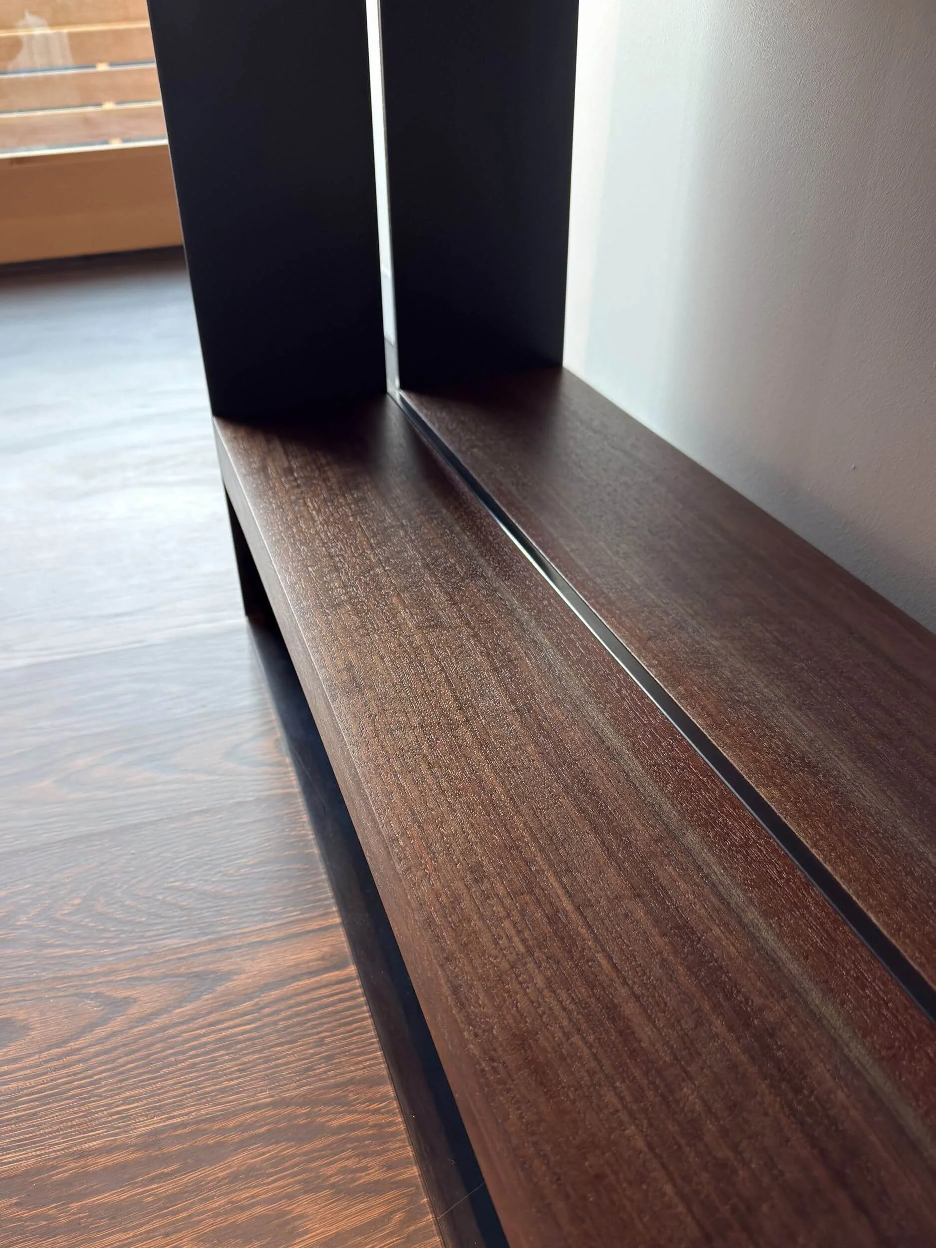 Walnut and blackened steel lower shelf on custom console table