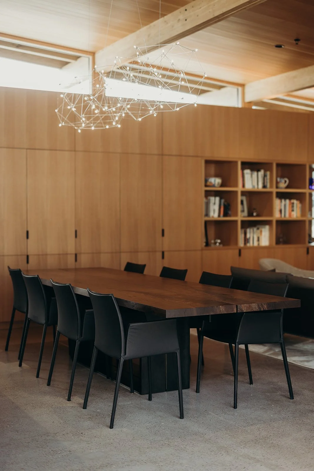 Custom walnut and blackened steel dining table