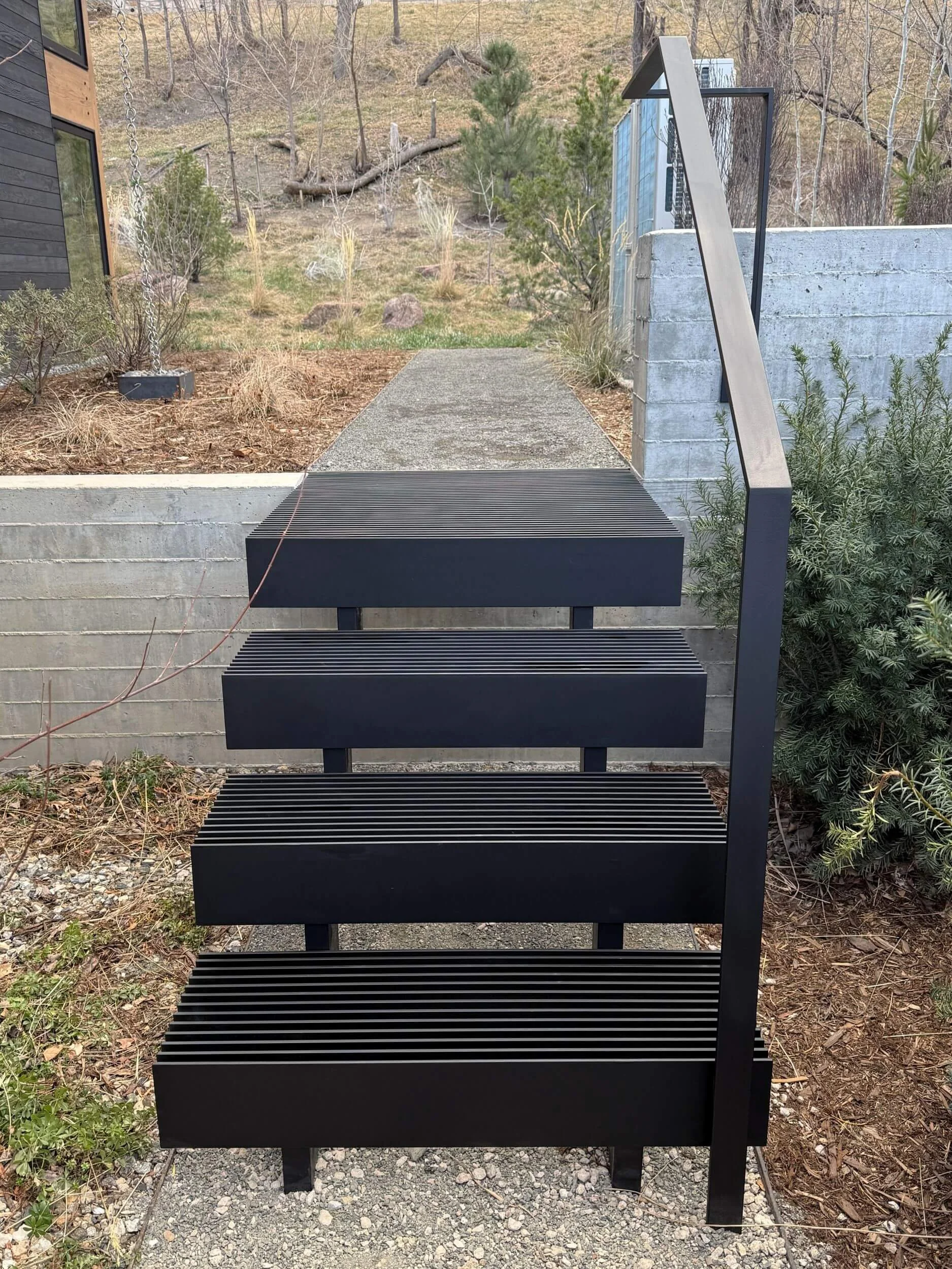 Modern steel exterior stairs and grab rail