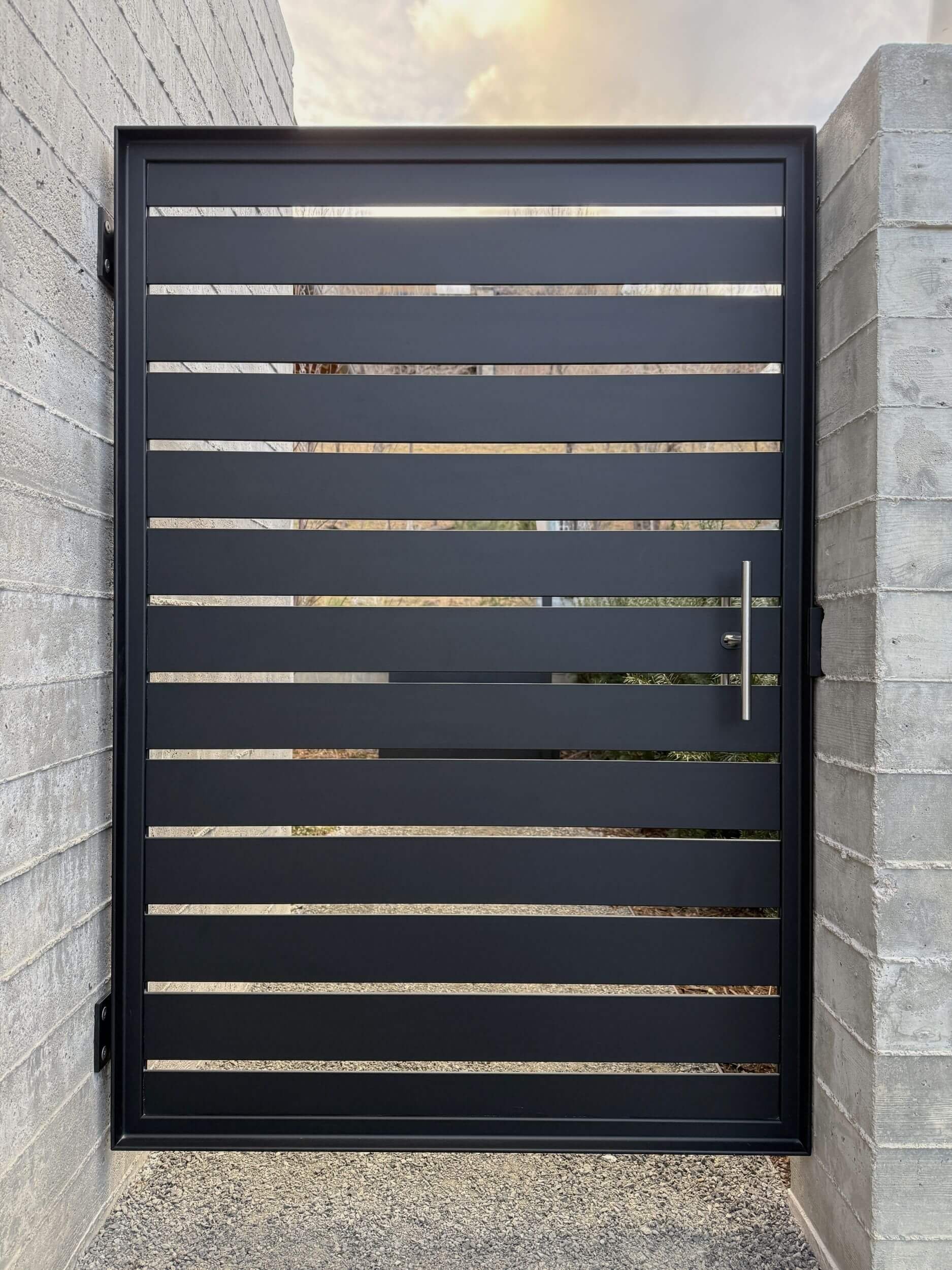 Custom modern steel gate with brushed stainless handle