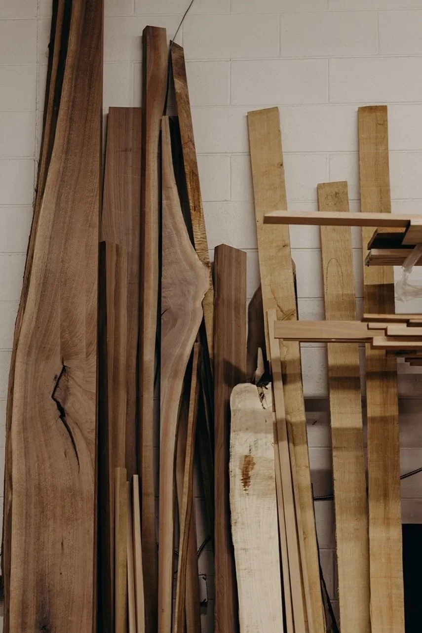 Stack of hardwoods in the Dust & Spark Studio