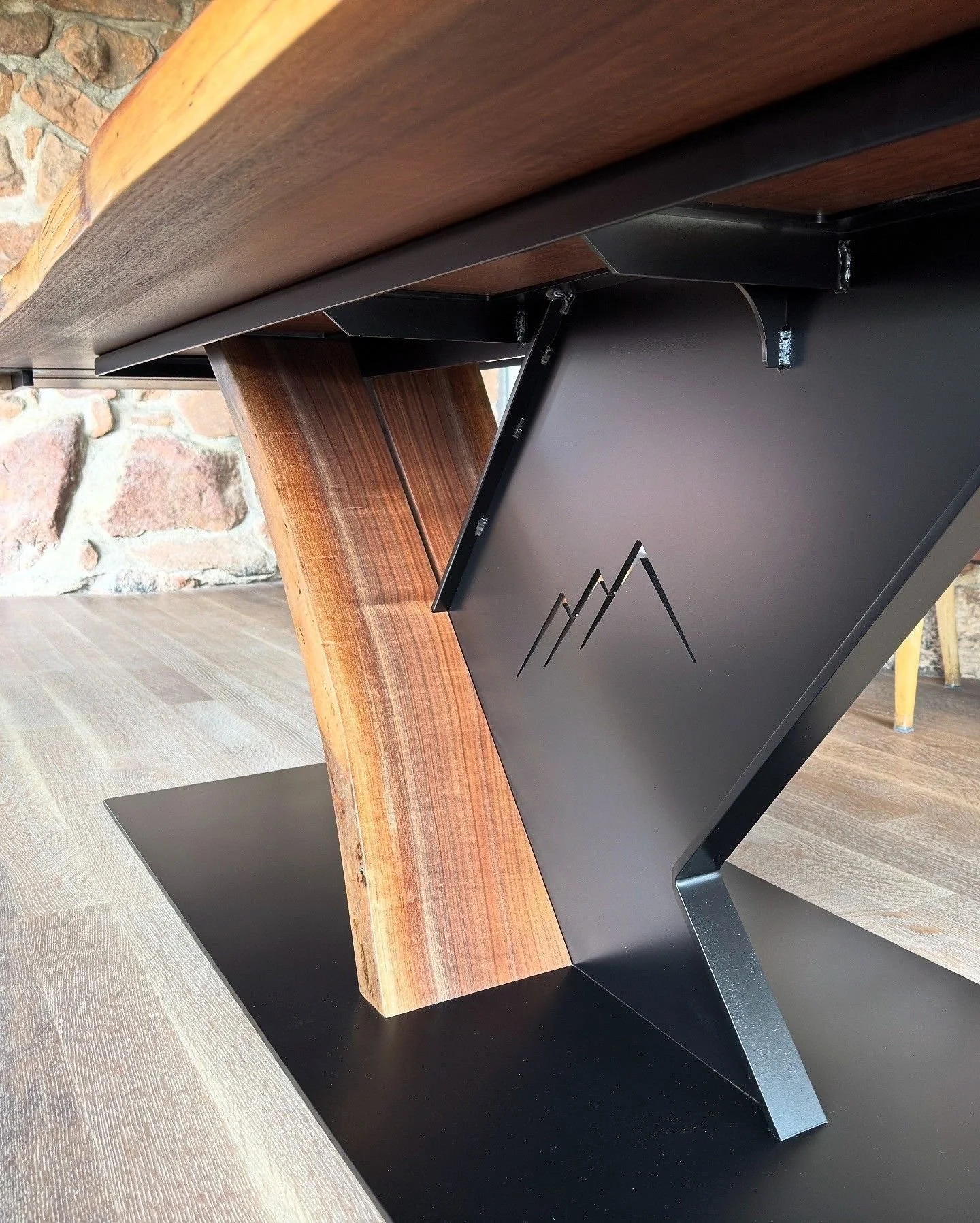 Custom restaurant table base with Flagstaff House logo