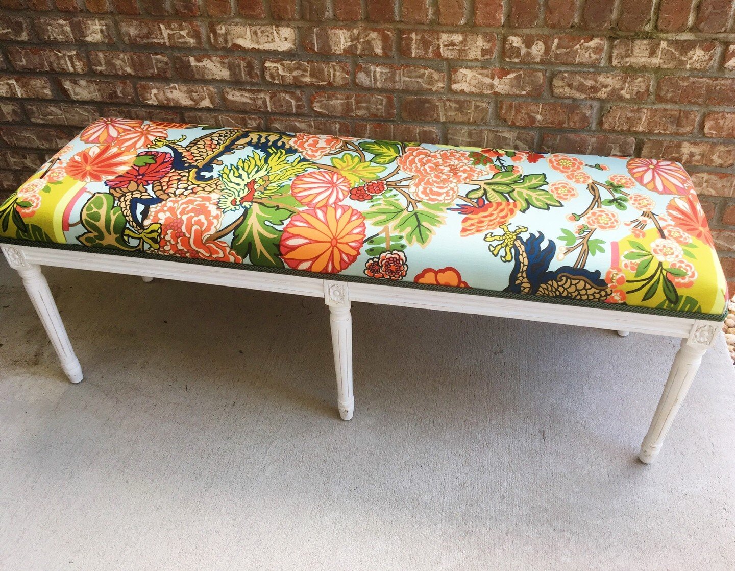 Dragons in the workroom! This upholstered bench is about as colorful and whimsical as you can get, My client LOVES bright and bold fabrics! I loved transforming this bench into a custom dream piece for a client&rsquo;s breakfast table. And the dragon