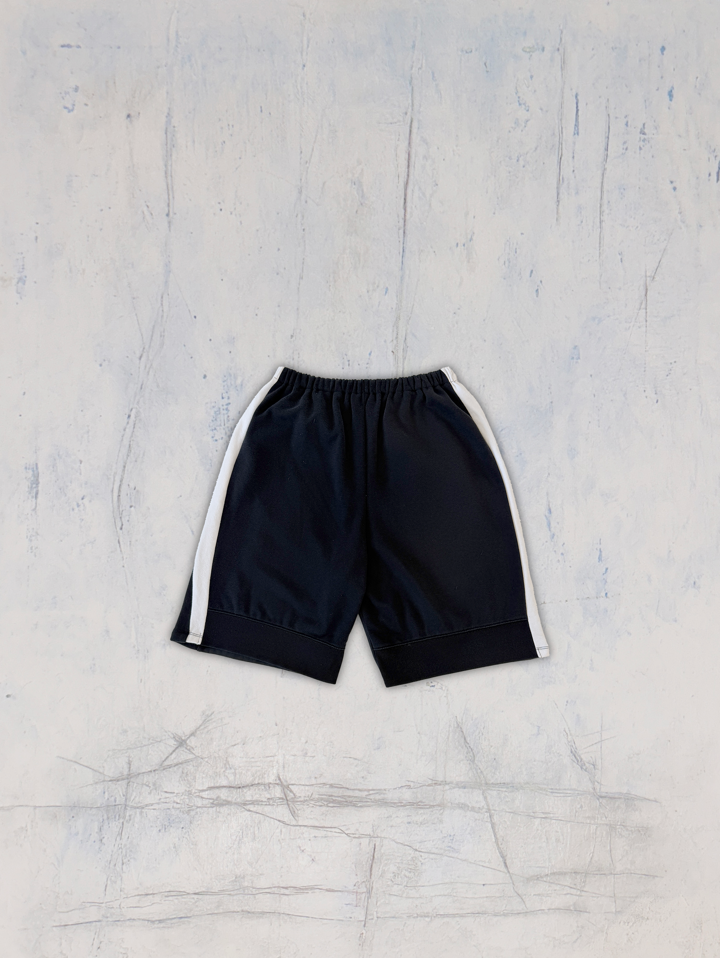 black trackshorts BACK.png